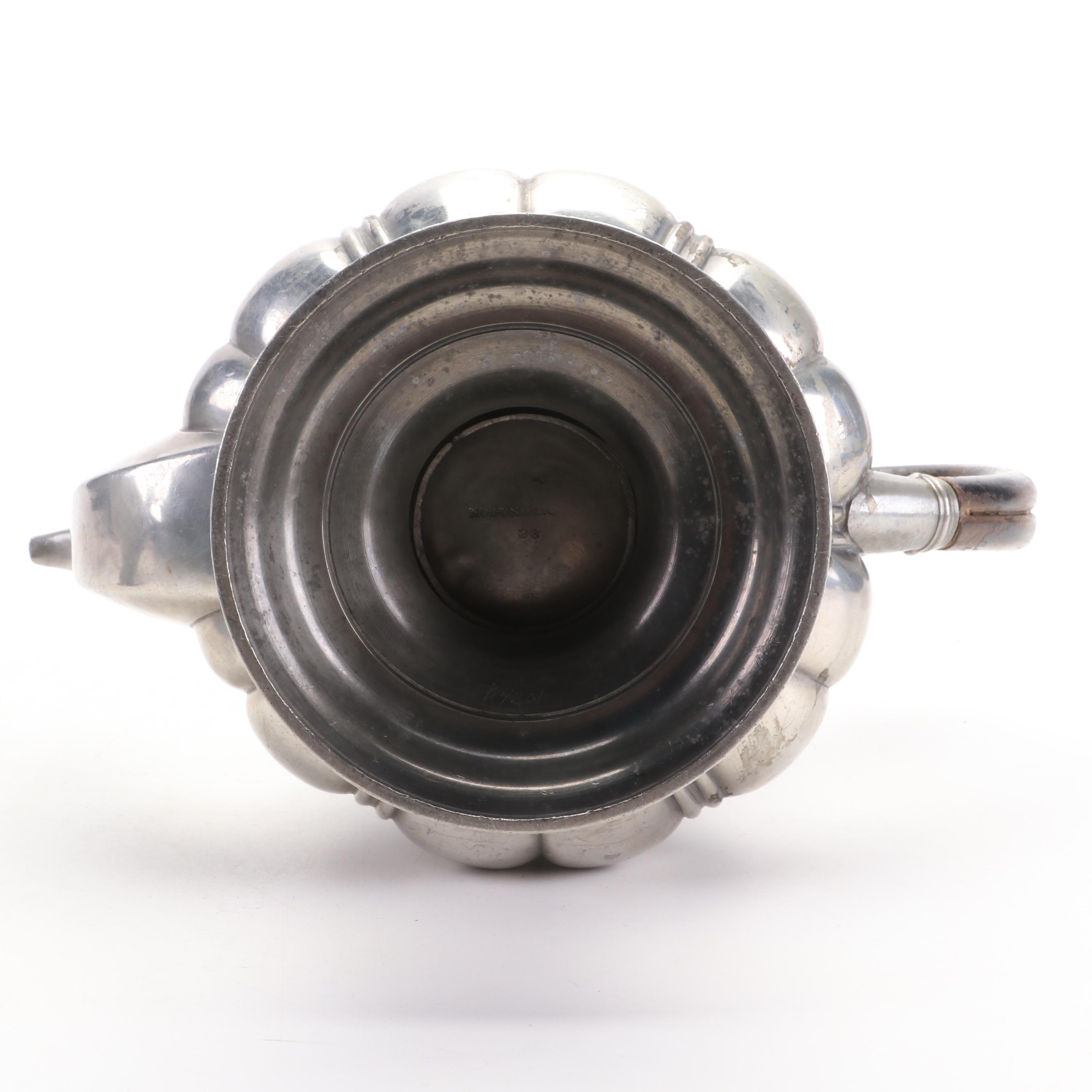 James Dixon & Son and Other Pewter Teapots with Silver Plate Candlesticks