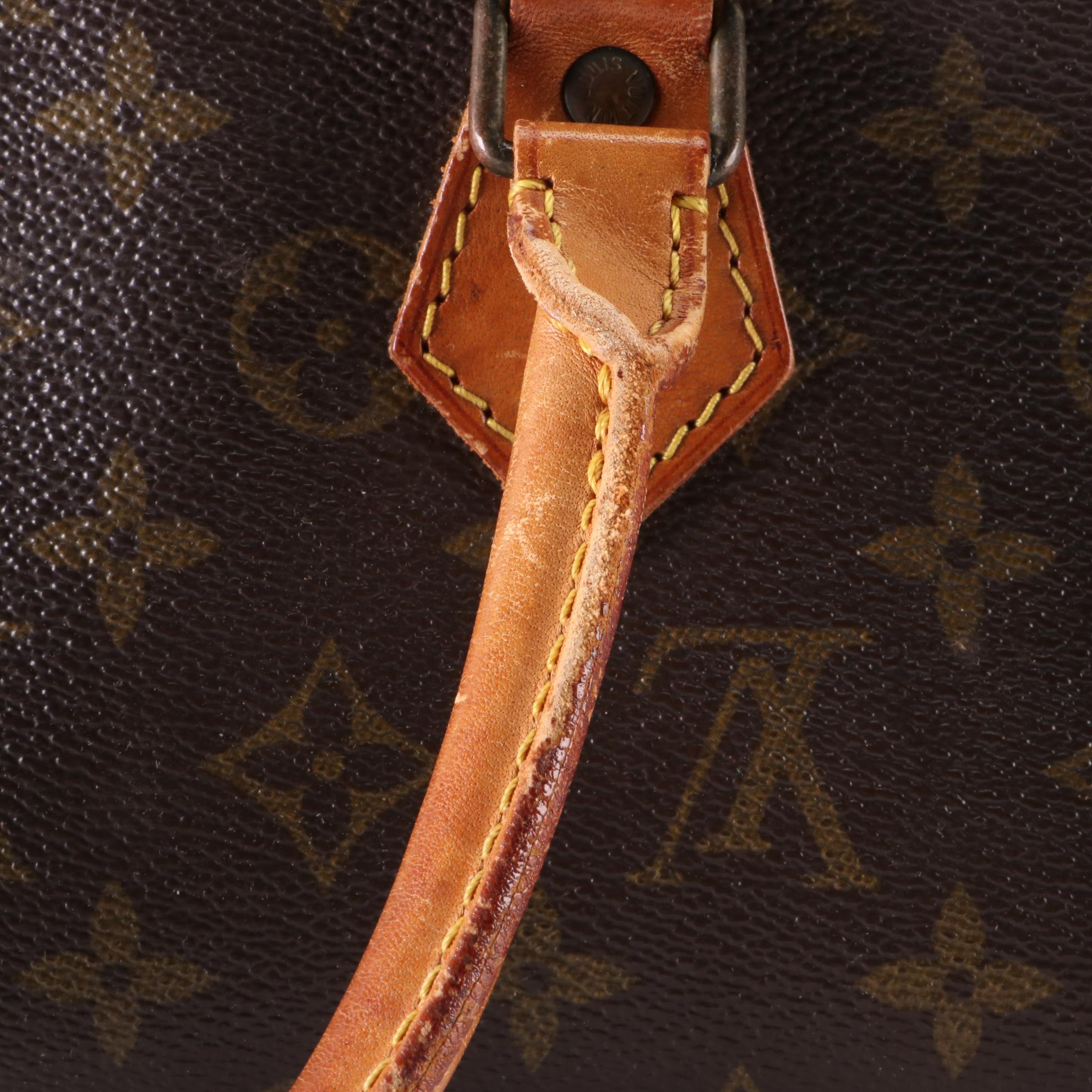 Louis Vuitton Sac Triangle in Monogram Canvas and Vachetta Leather