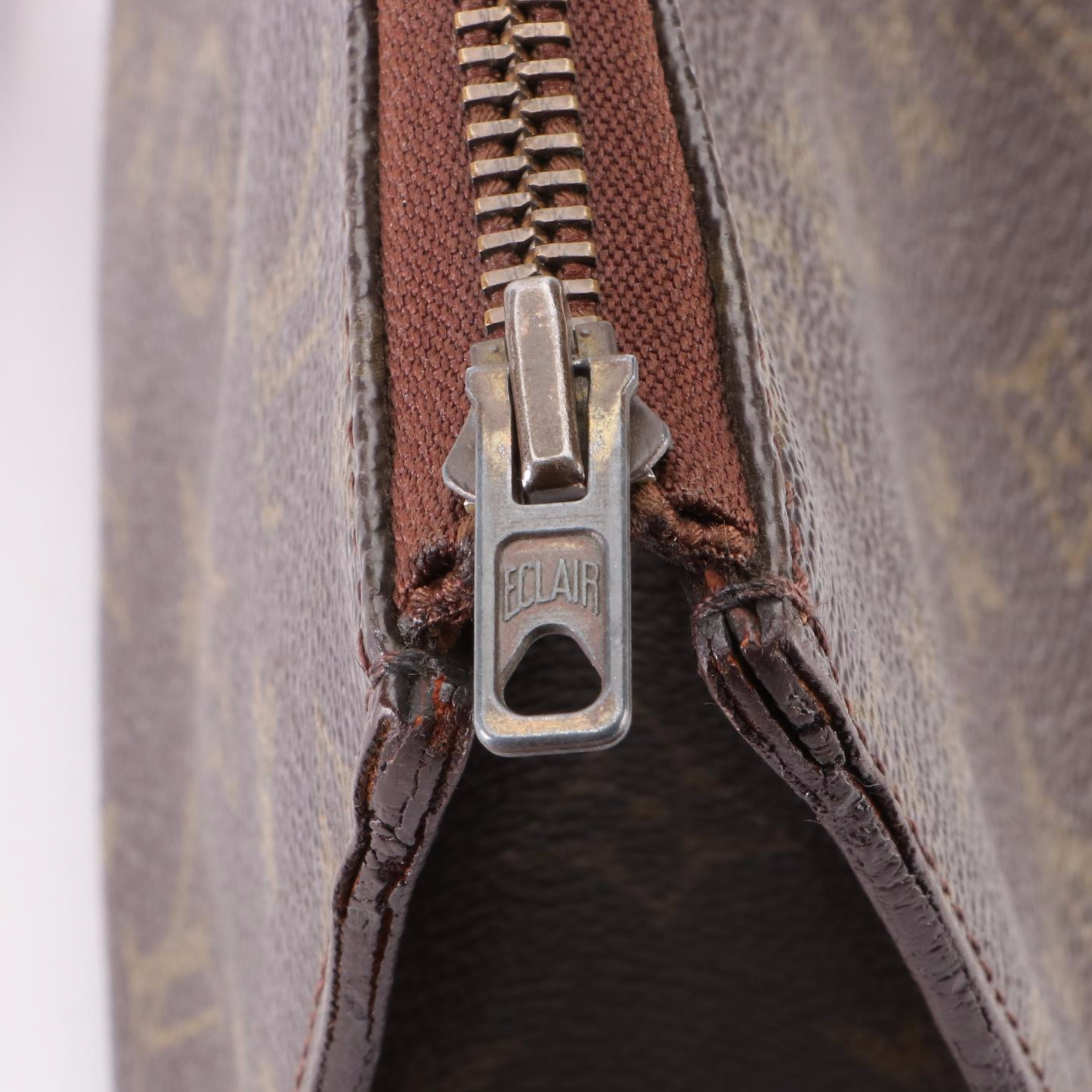 Louis Vuitton Sac Triangle in Monogram Canvas and Vachetta Leather