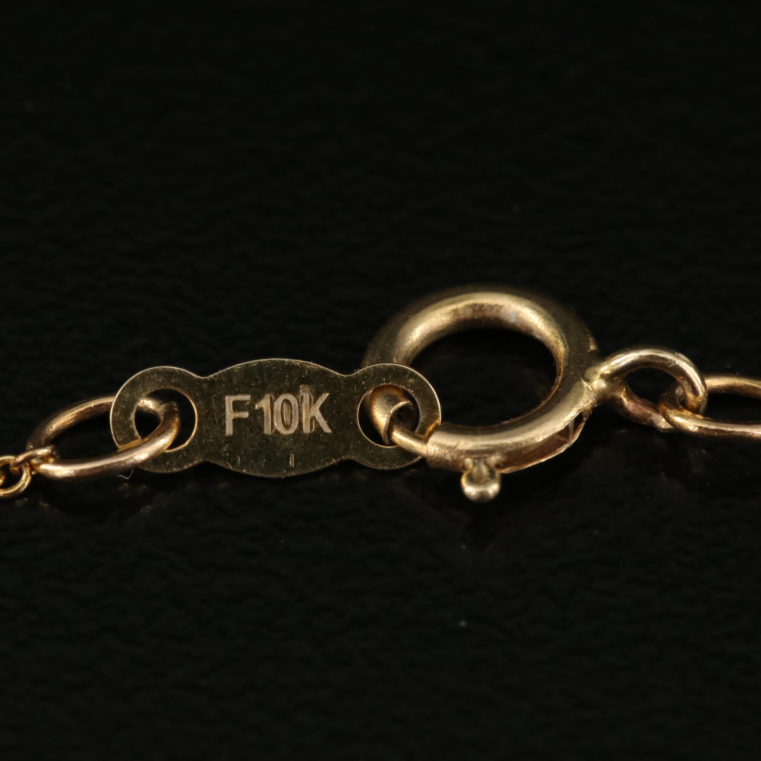 10K 0.06 CTW Diamond Pendant Necklace