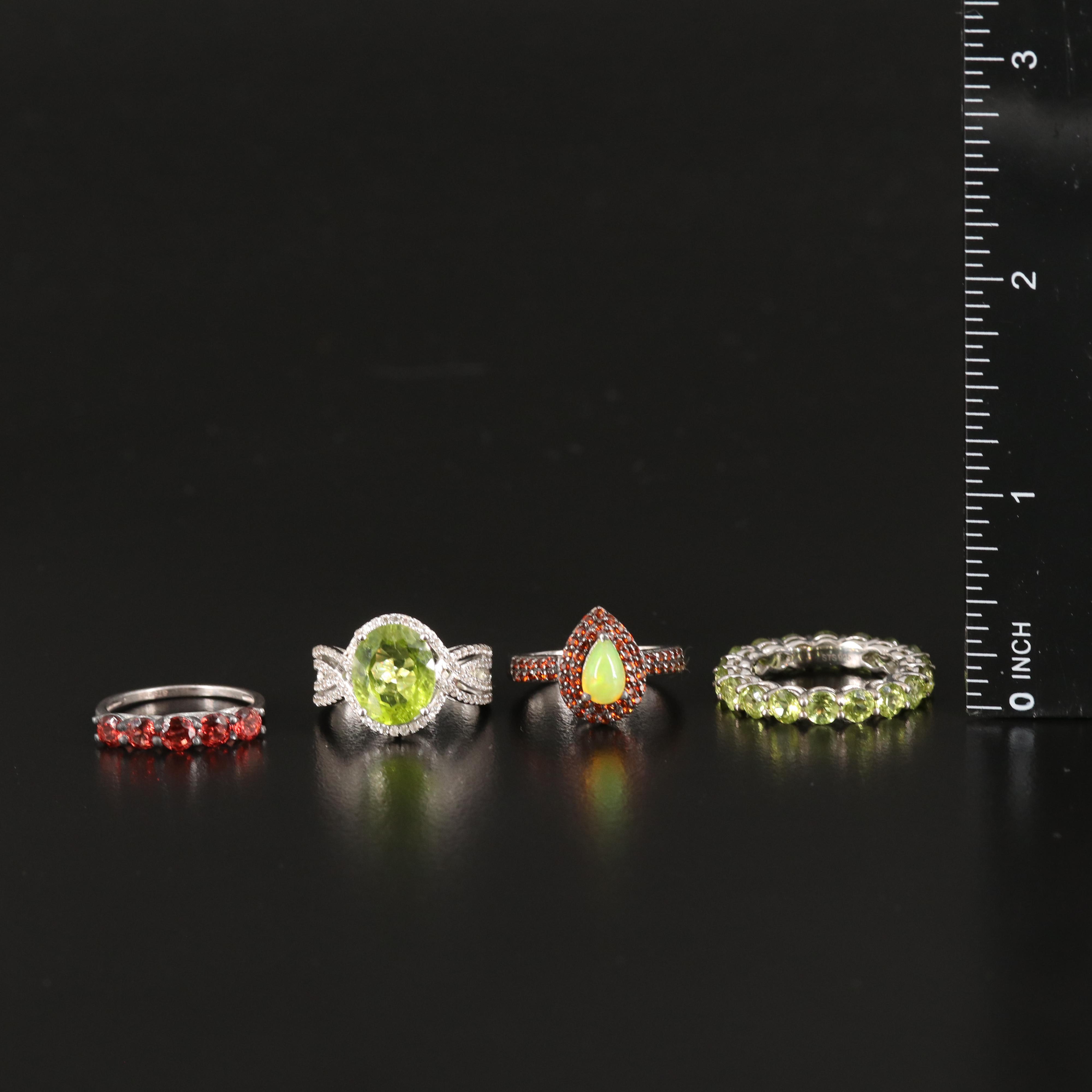Opal, Peridot and Zircon Featured in Sterling Rings