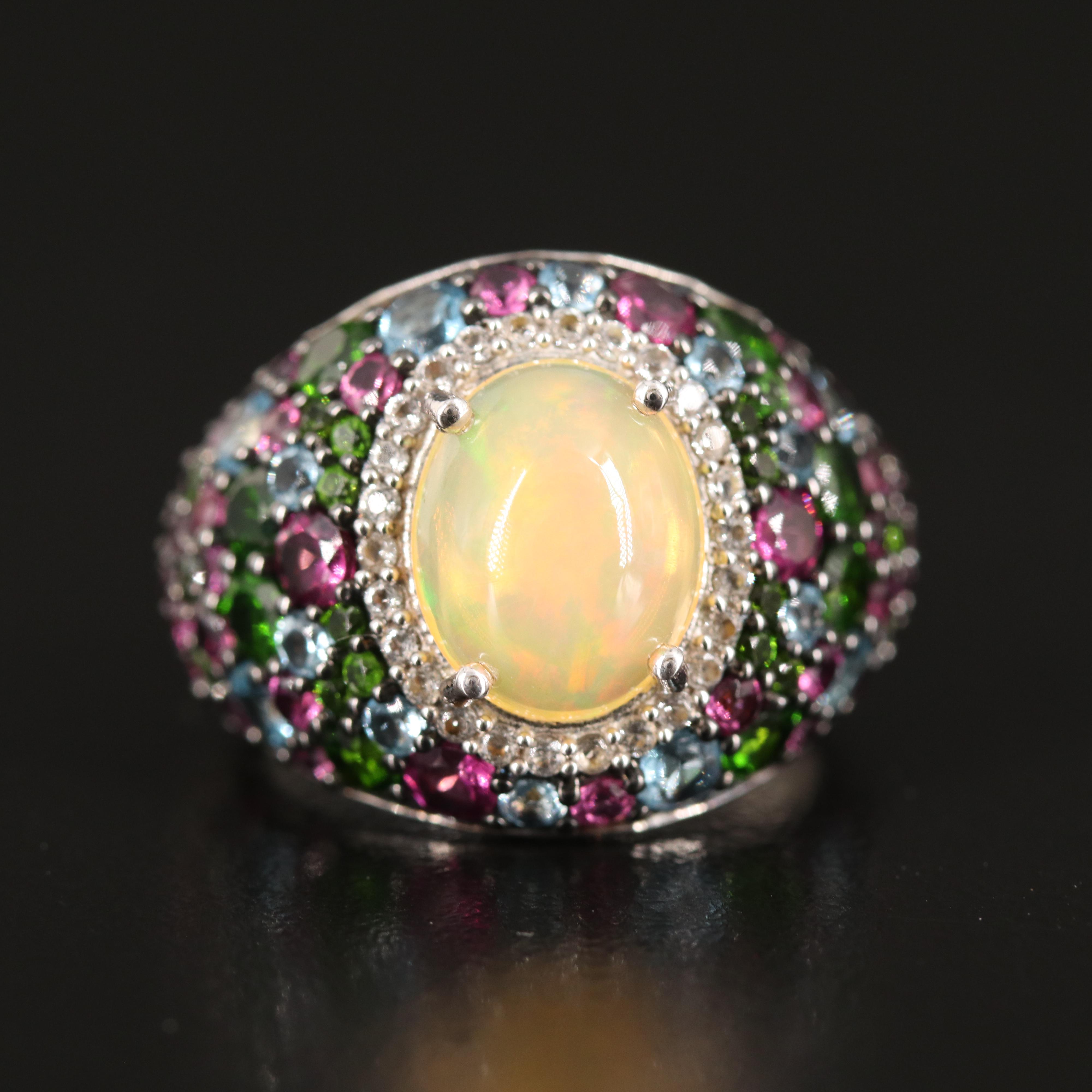 Opal Ring with Diopside Halo and Swiss Blue Topaz Accents in Sterling
