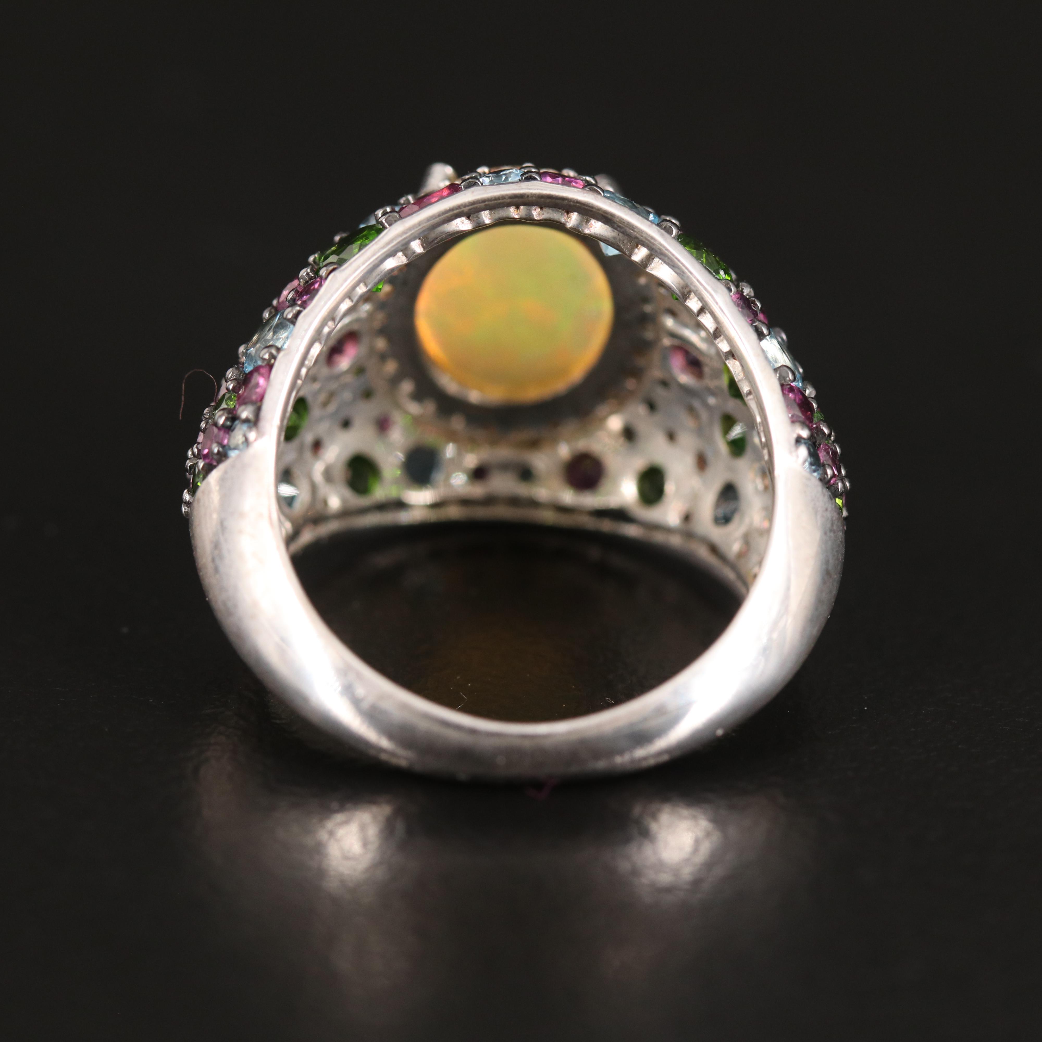Opal Ring with Diopside Halo and Swiss Blue Topaz Accents in Sterling