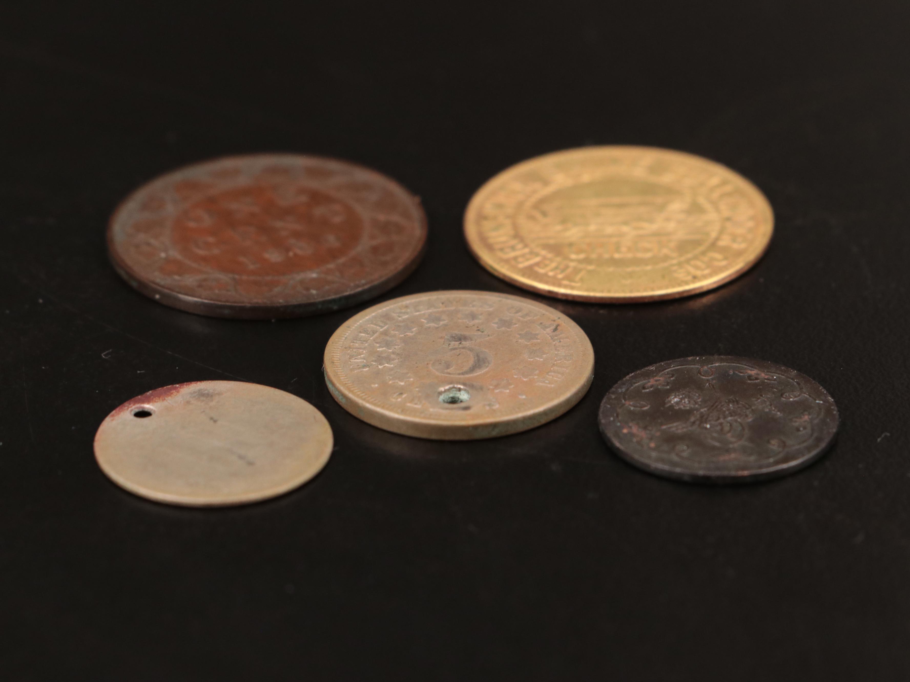 Four Coins and Brunswick Balke Collender Merchant Token