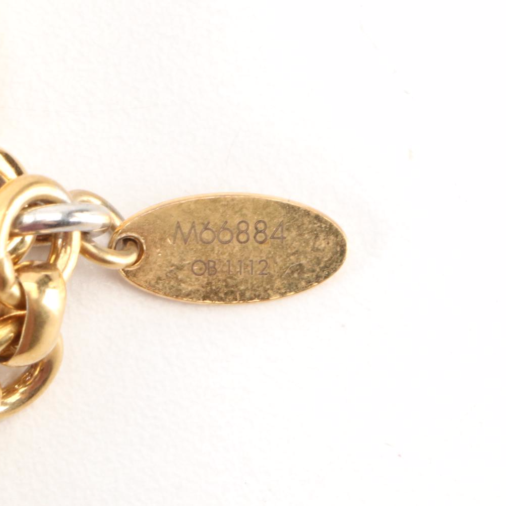 Louis Vuitton Insolence Bag Charm in Gold Tone Metal and Resin