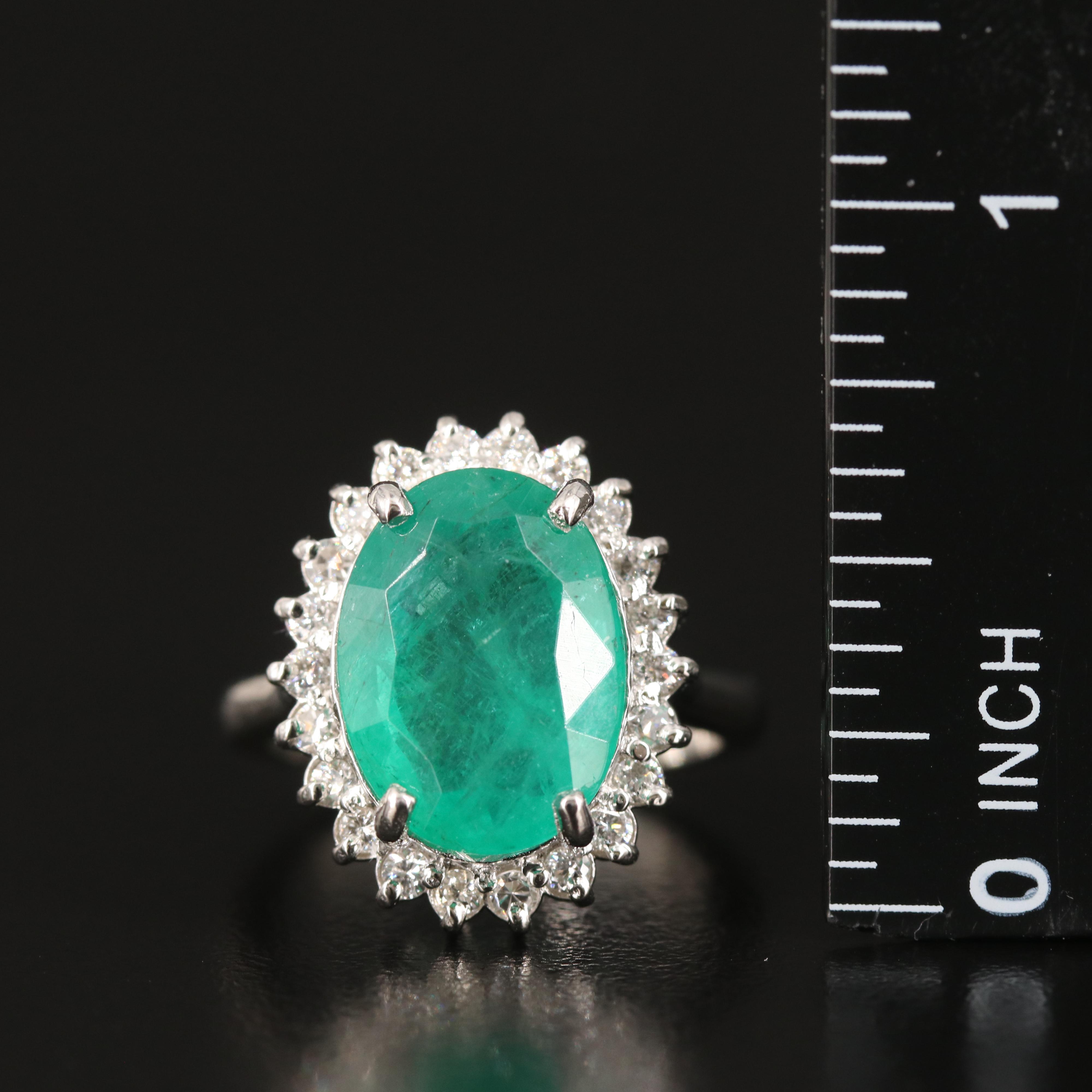 Platinum 6.31 CT Emerald and Diamond Ring with GIA Report