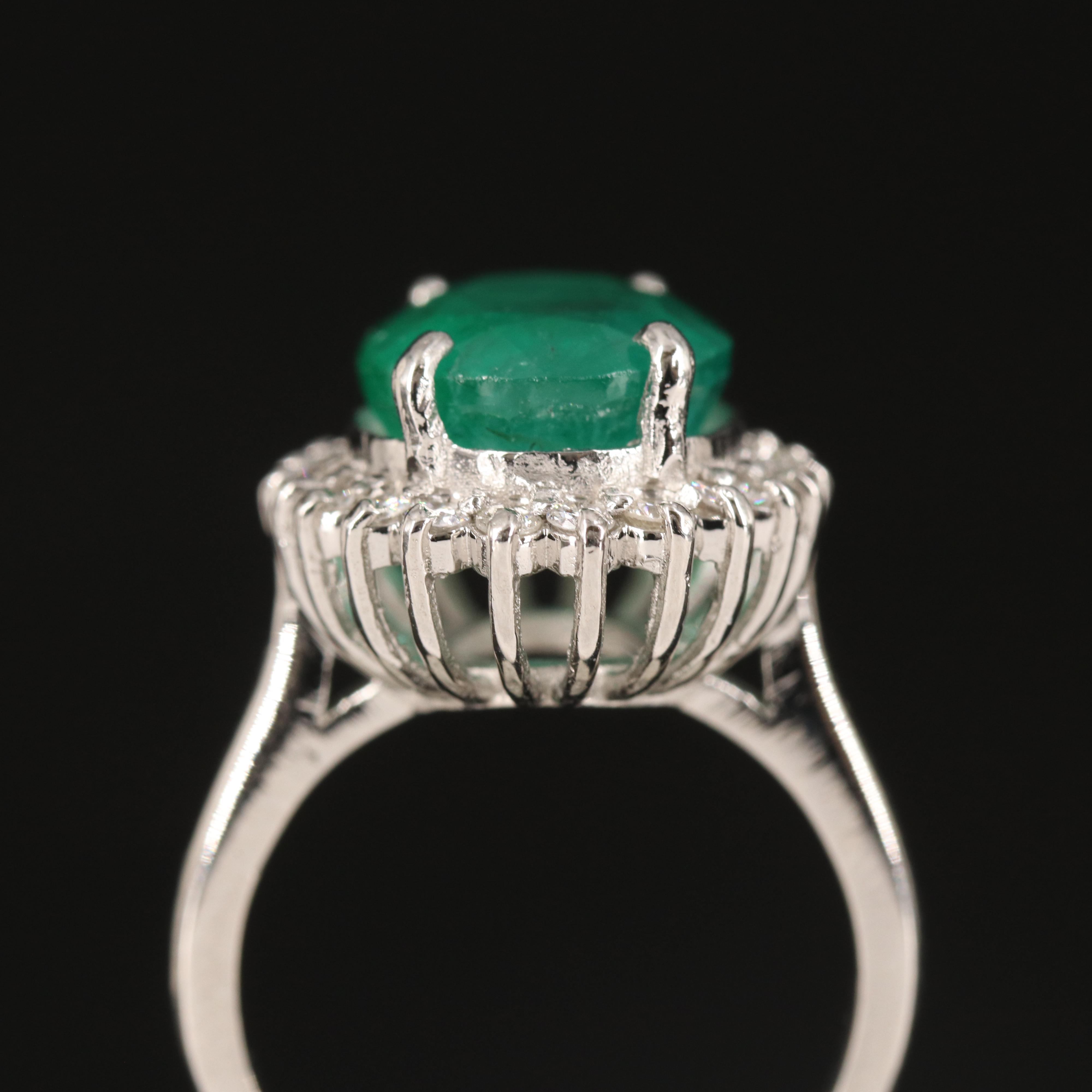 Platinum 6.31 CT Emerald and Diamond Ring with GIA Report