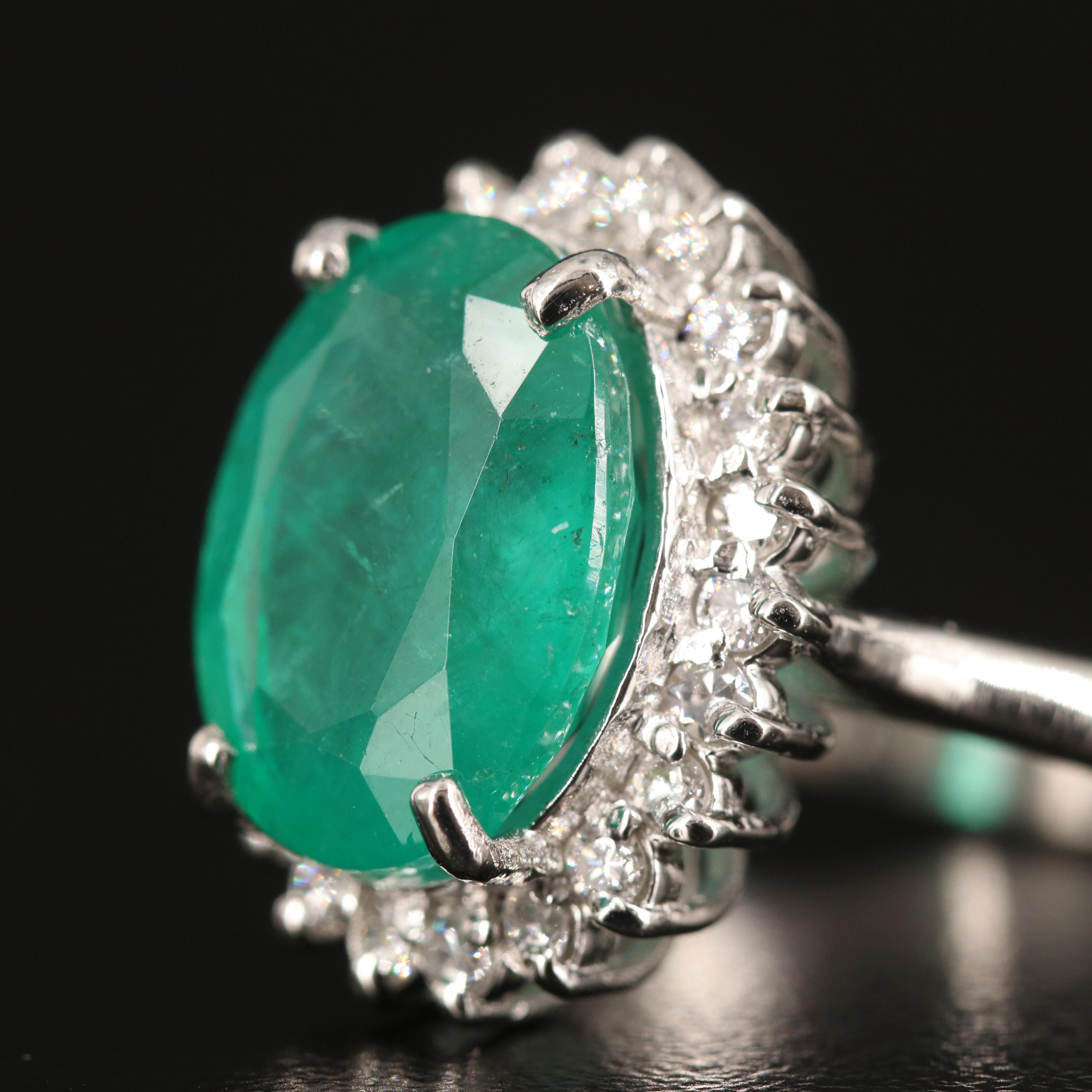 Platinum 6.31 CT Emerald and Diamond Ring with GIA Report