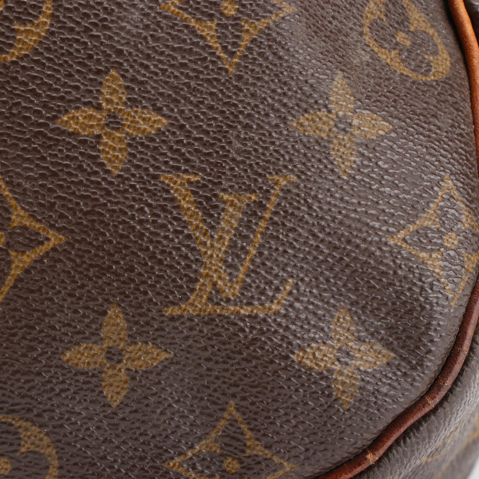 Louis Vuitton Saumur 35 Bag in Monogram Canvas and Vachetta Leather