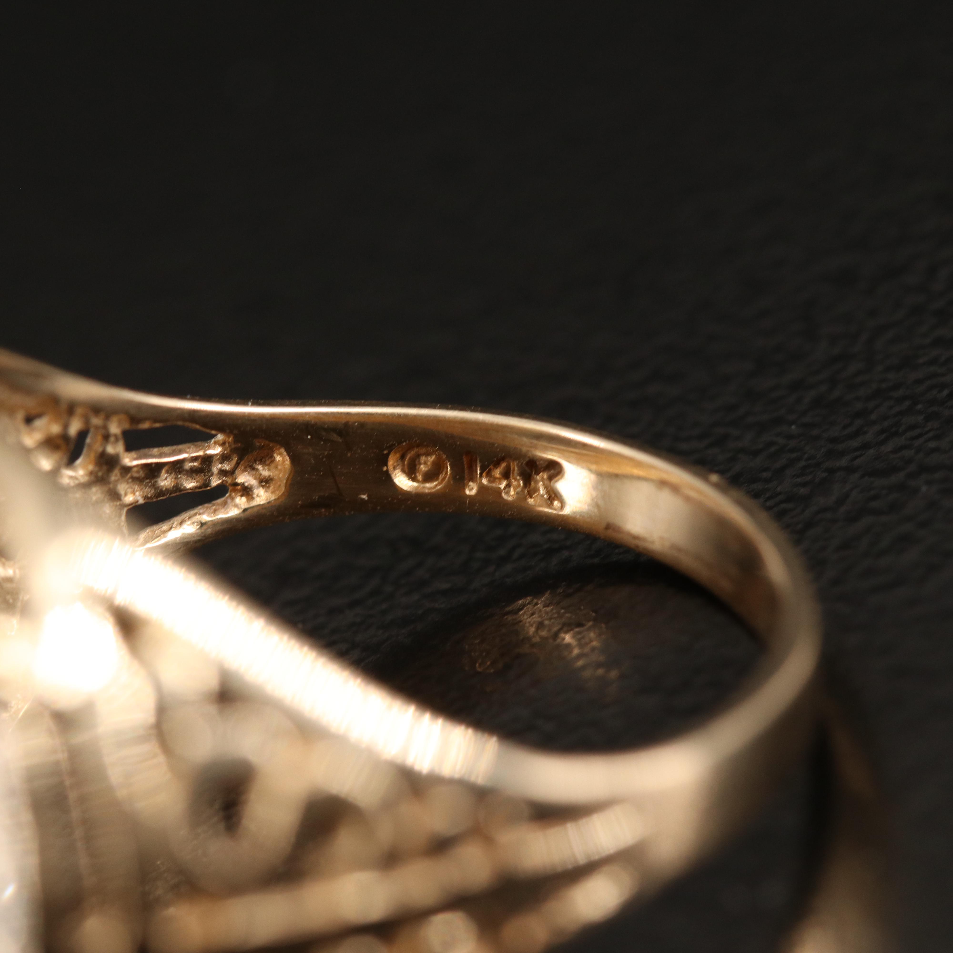 14K Diamond Ring Holding Isle of Man 1/25th Platinum Crown Bullion Coin