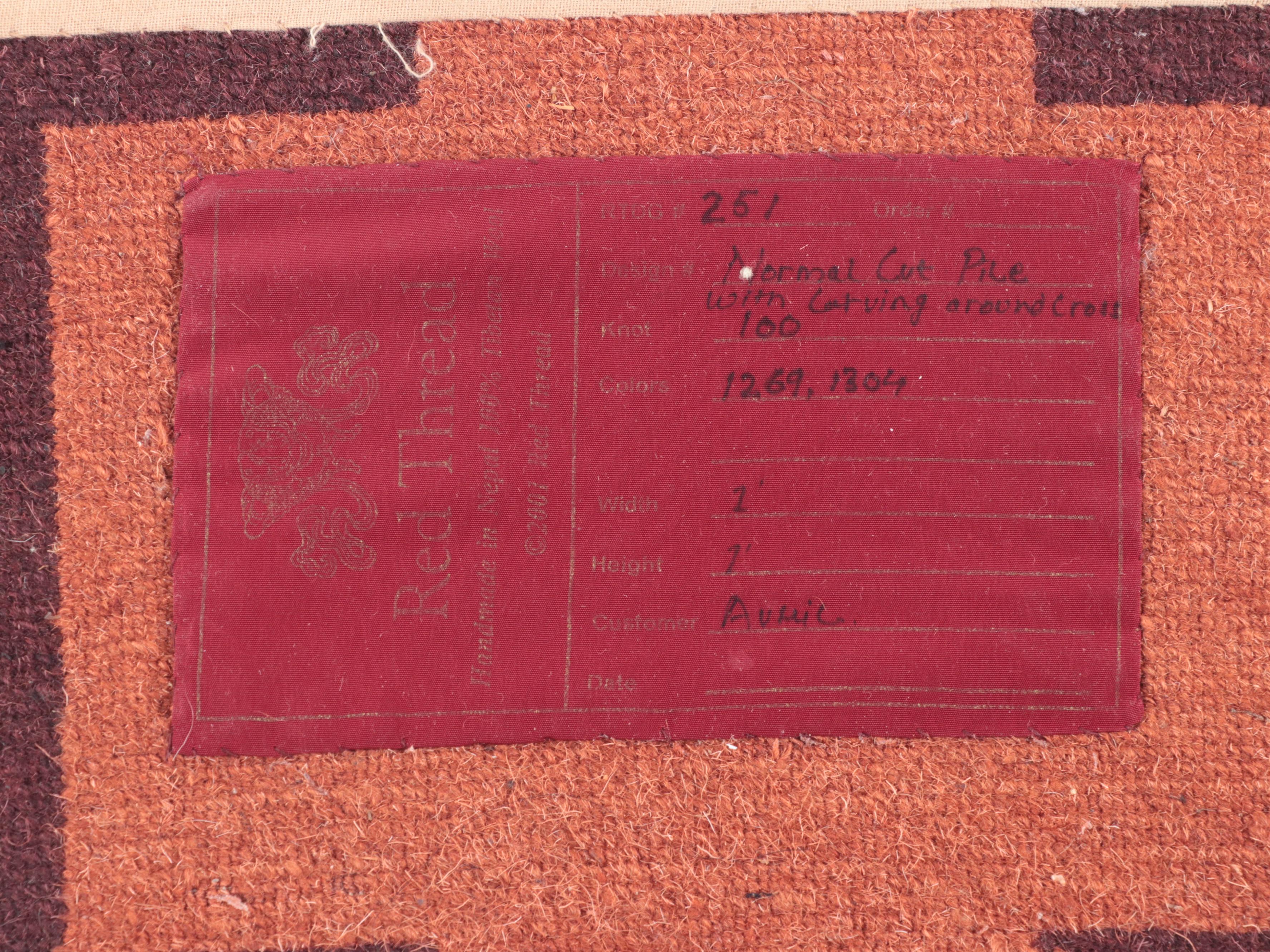 Two 1' x 1' Hand-Knotted Red Thread Nepalese Floor Mats with Cross