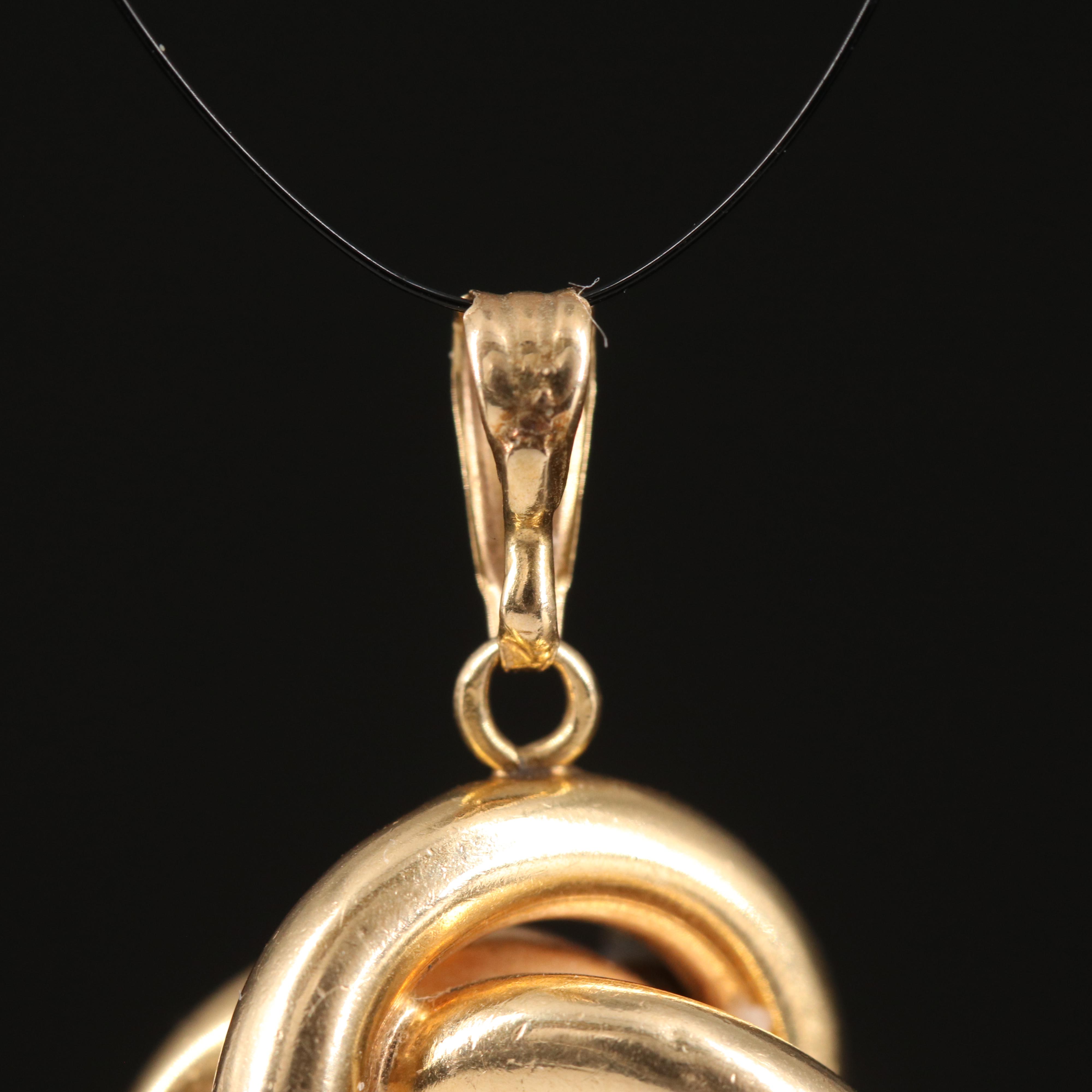 14K 0.09 CTW Diamond Love Knot Pendant