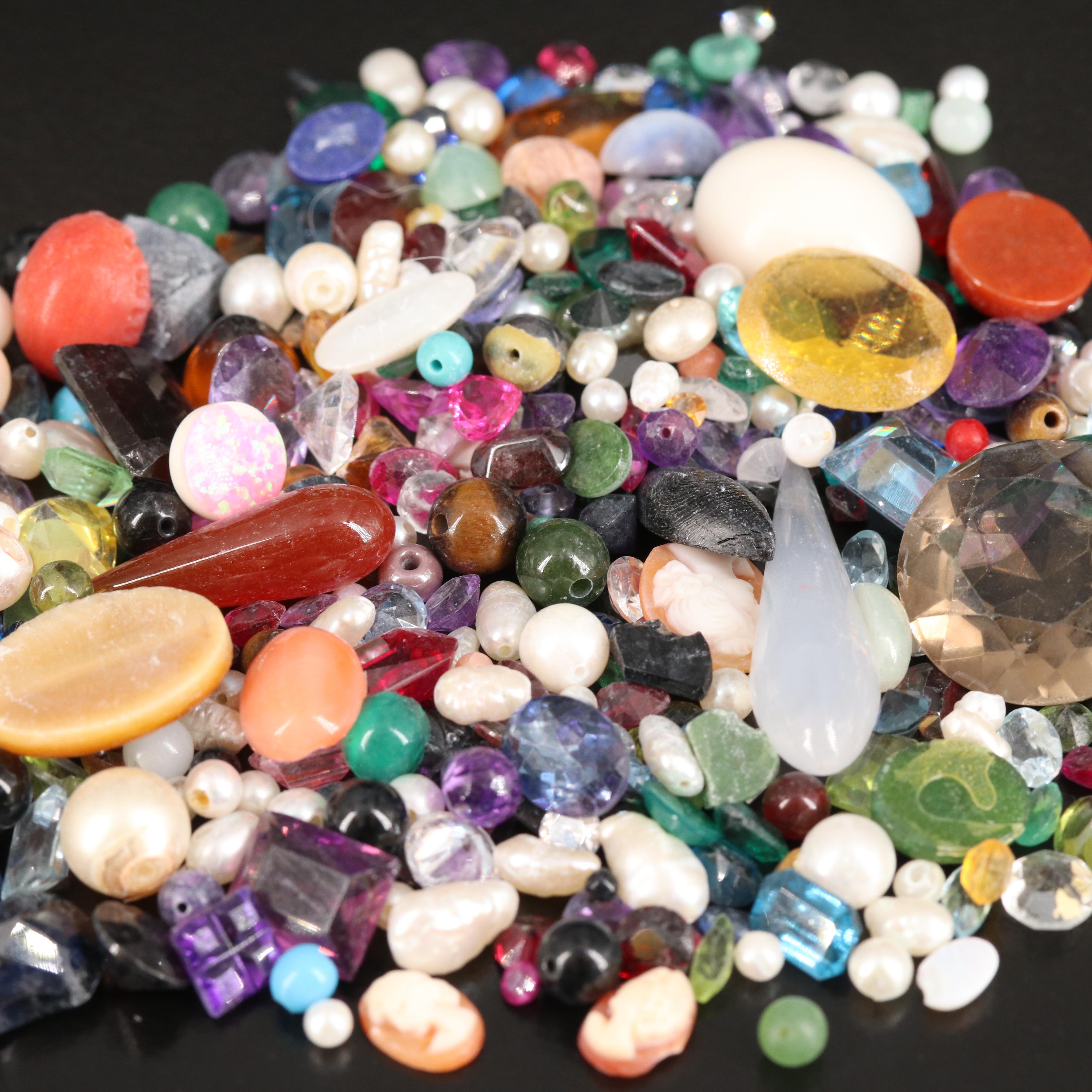 Loose Gemstones Including Smoky Quartz, Coral, and Pearl