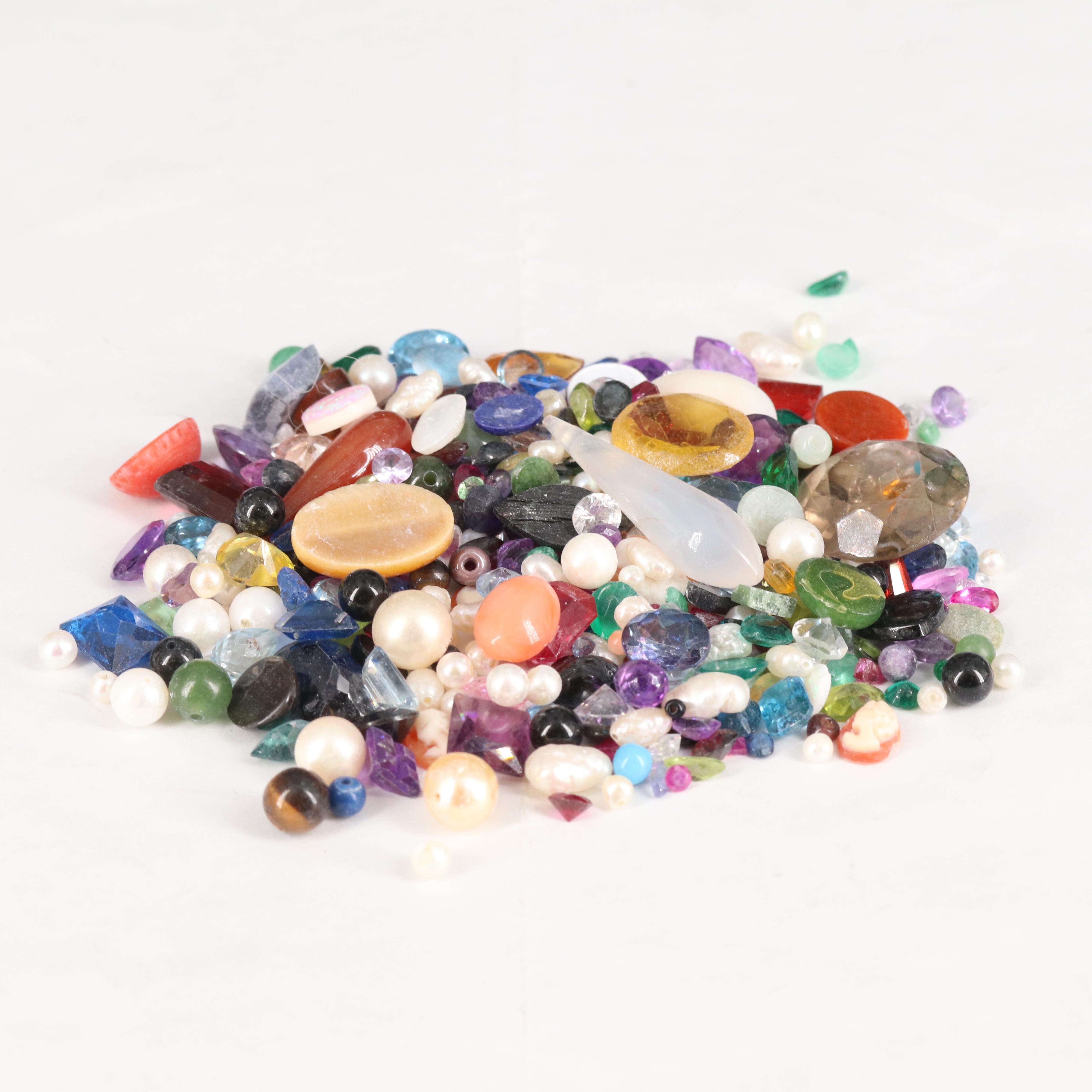 Loose Gemstones Including Smoky Quartz, Coral, and Pearl