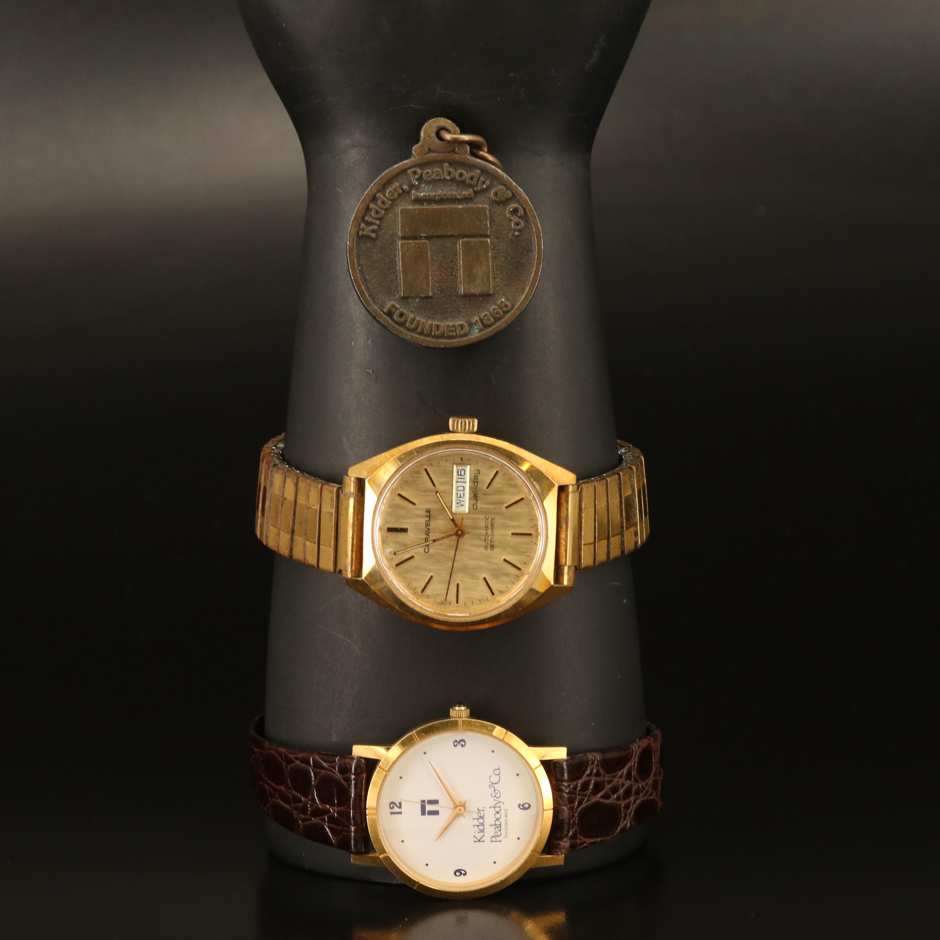 Caravelle and Kidder-Peabody Gold-Tone Watches with Medallion