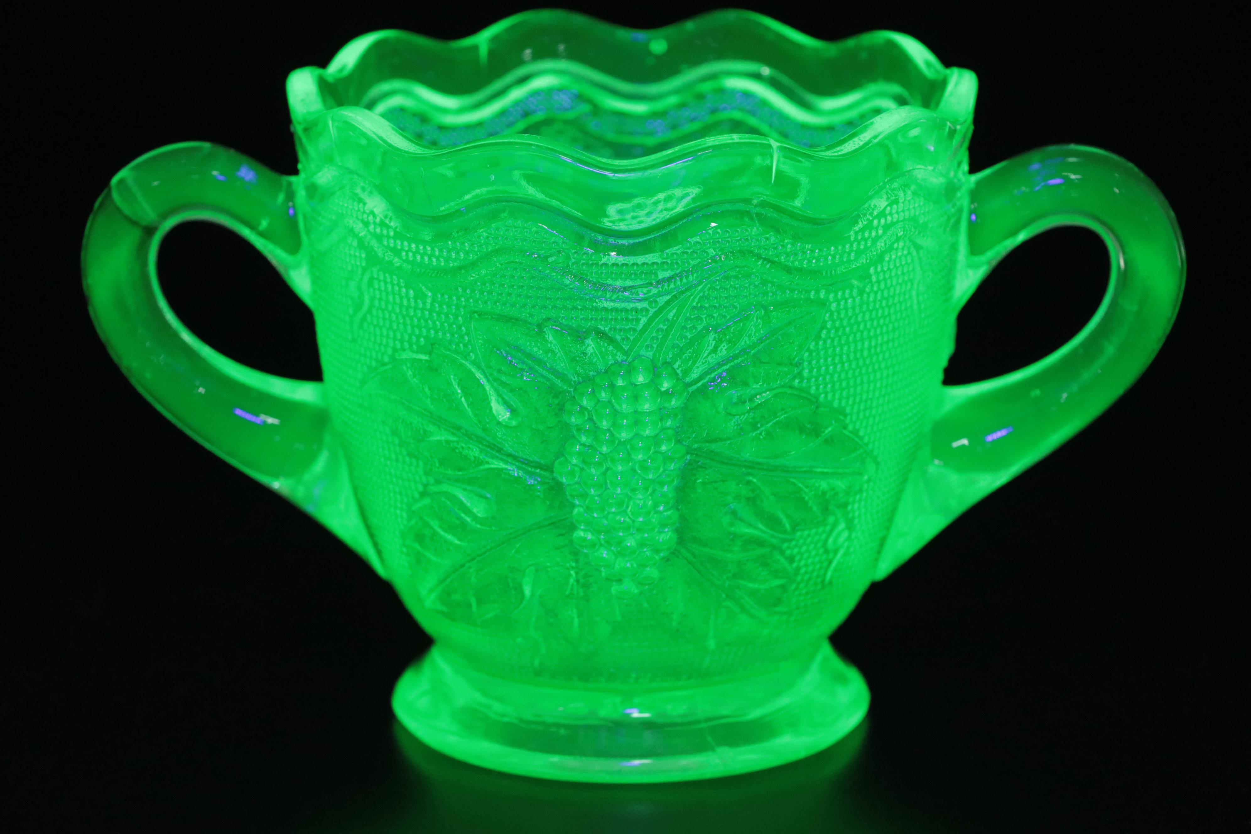 Westmoreland "Woolworth" Sugar Bowl and Other Green Glass Tableware, 20th C.
