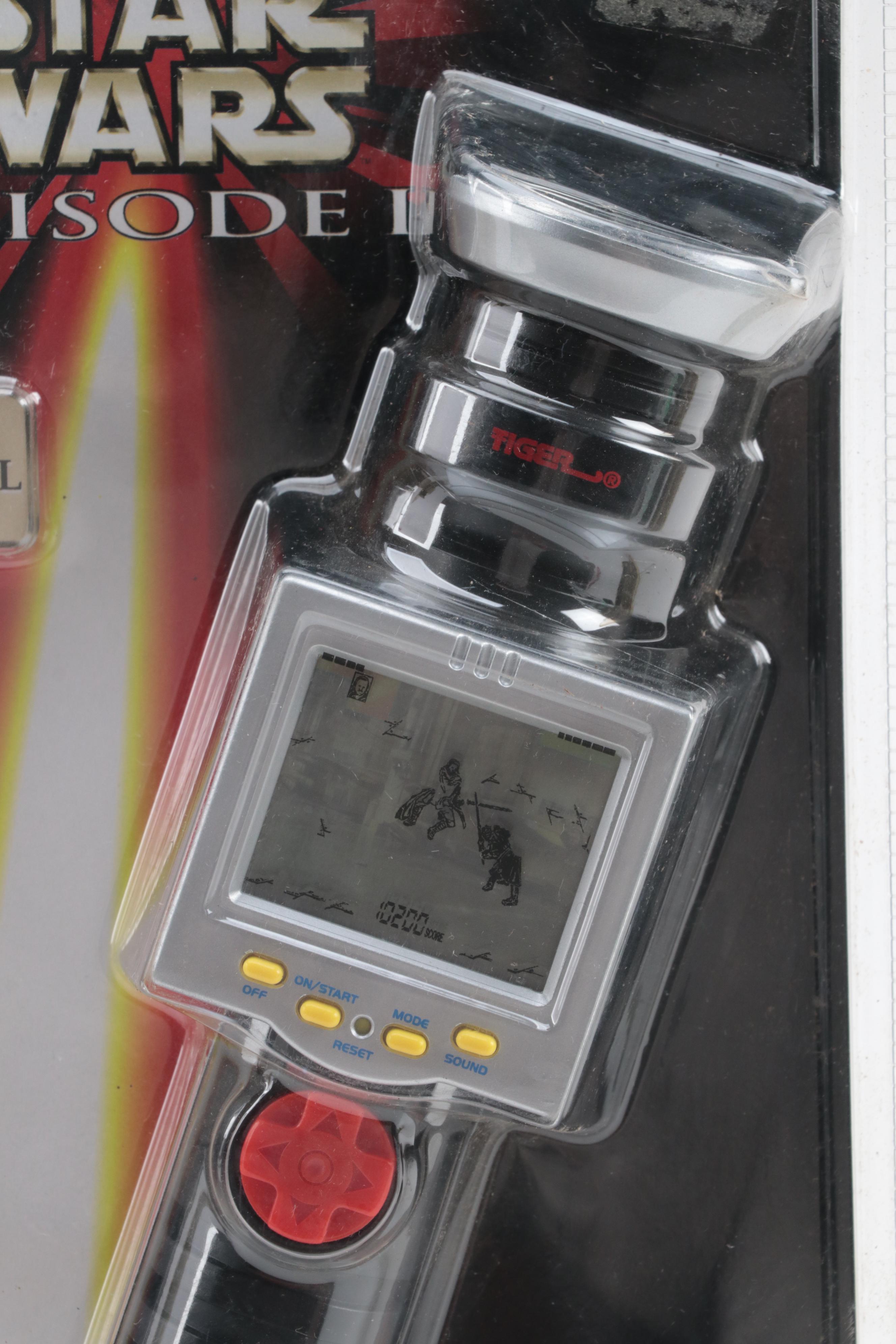 Tiger Electronics Lightsaber Duel Game and Bandai Jetfire Transformer Toy