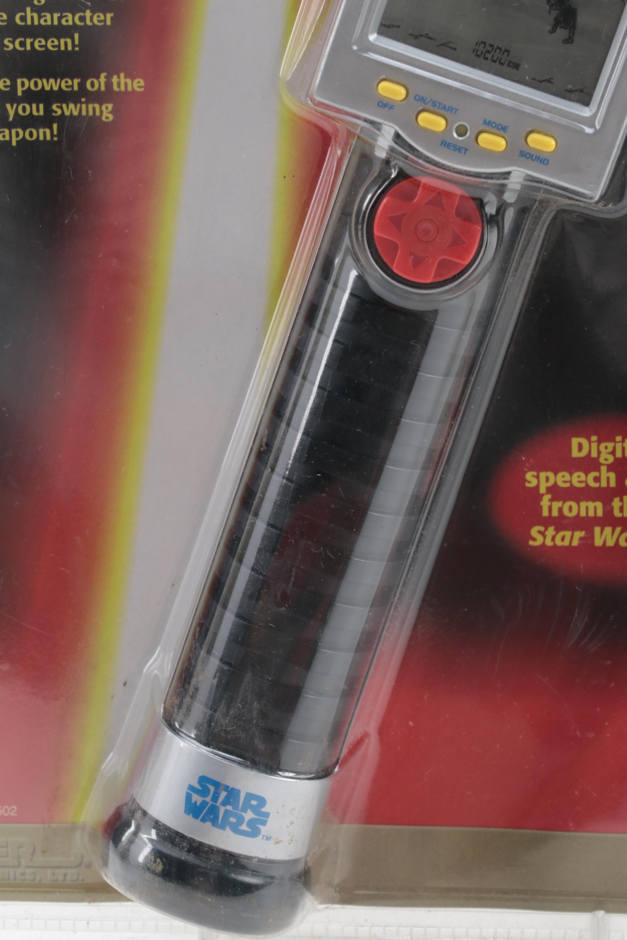 Tiger Electronics Lightsaber Duel Game and Bandai Jetfire Transformer Toy