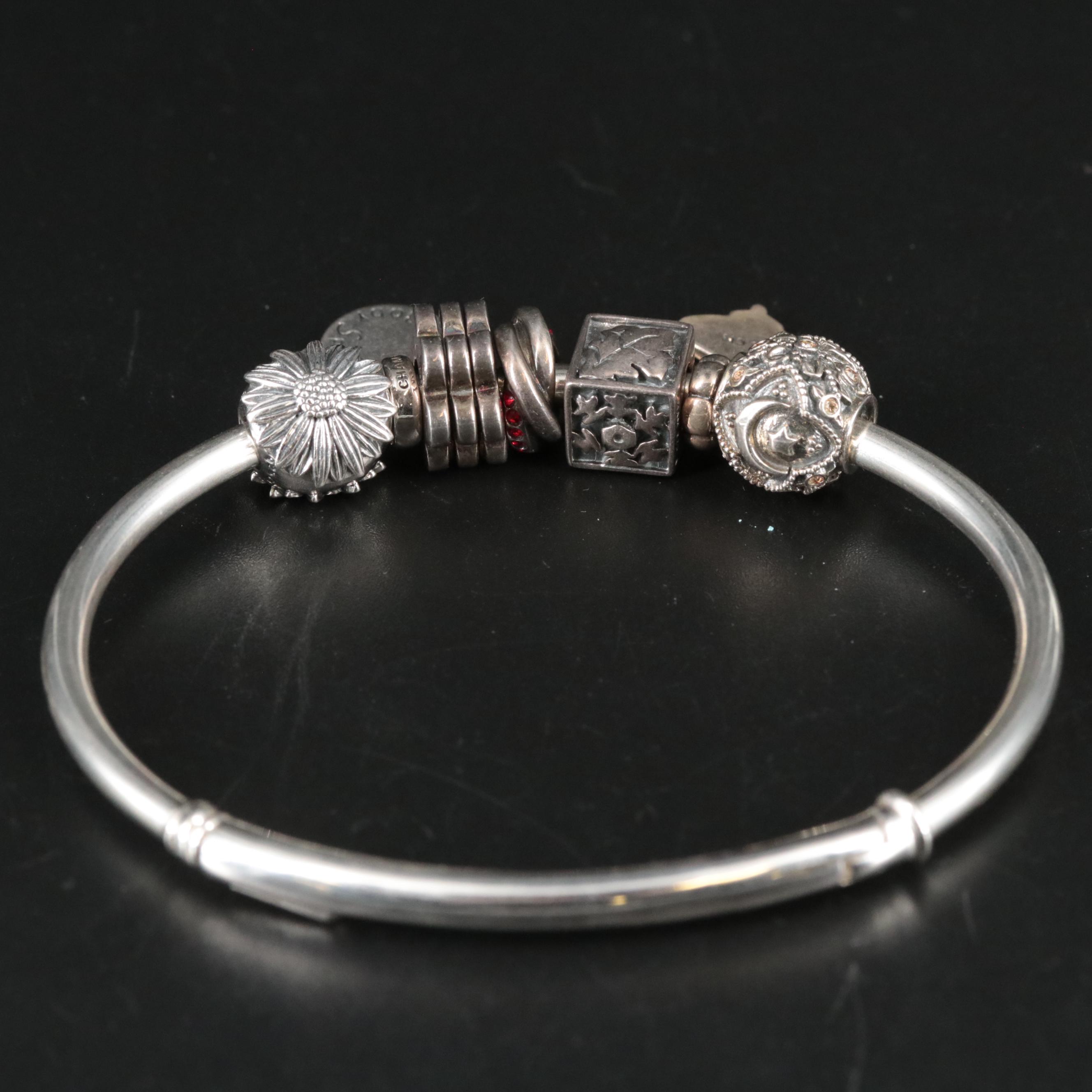 Sterling Bracelet Featuring Lotus Flower and Other Charms