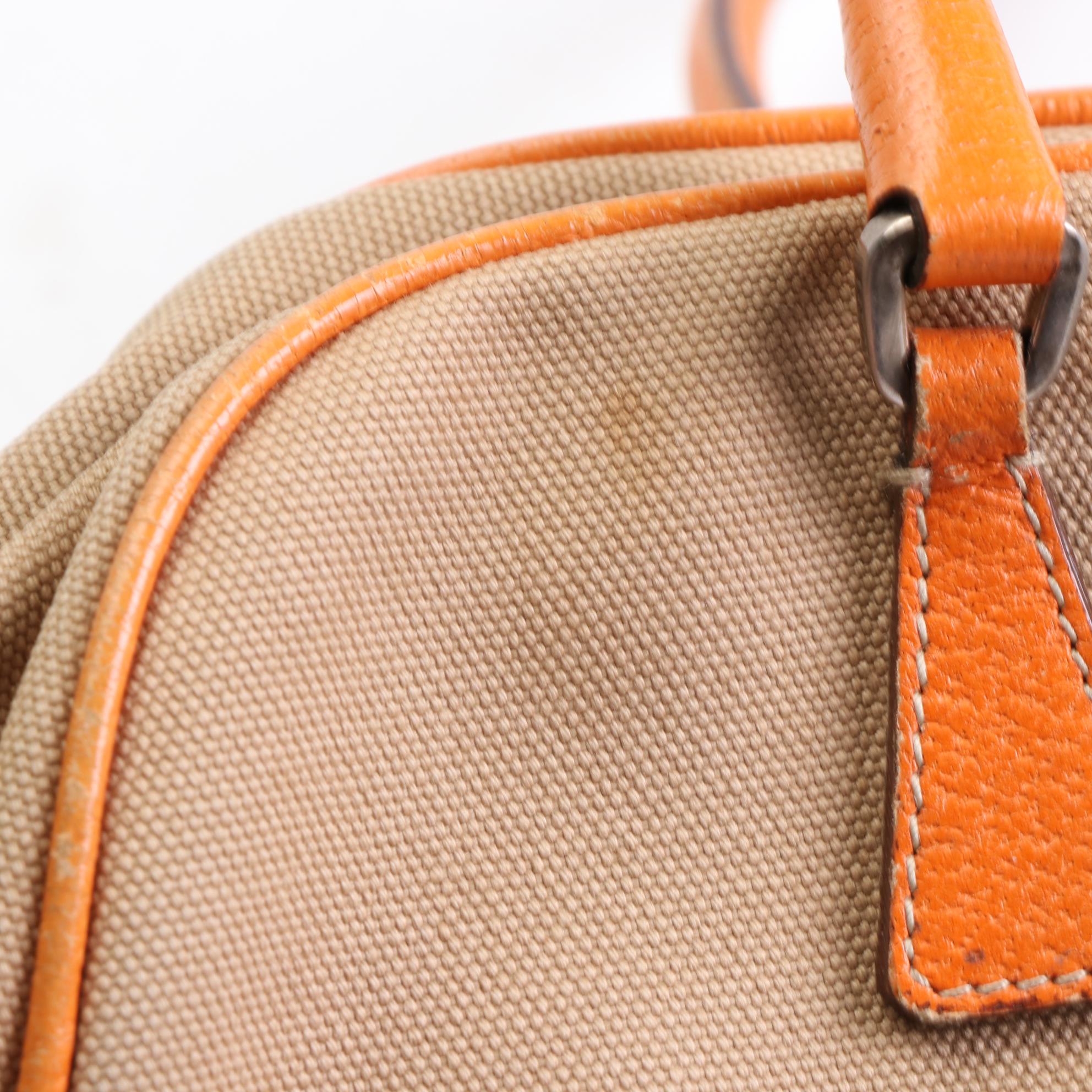 Prada Baguette in Canvas and Cinghi Leather