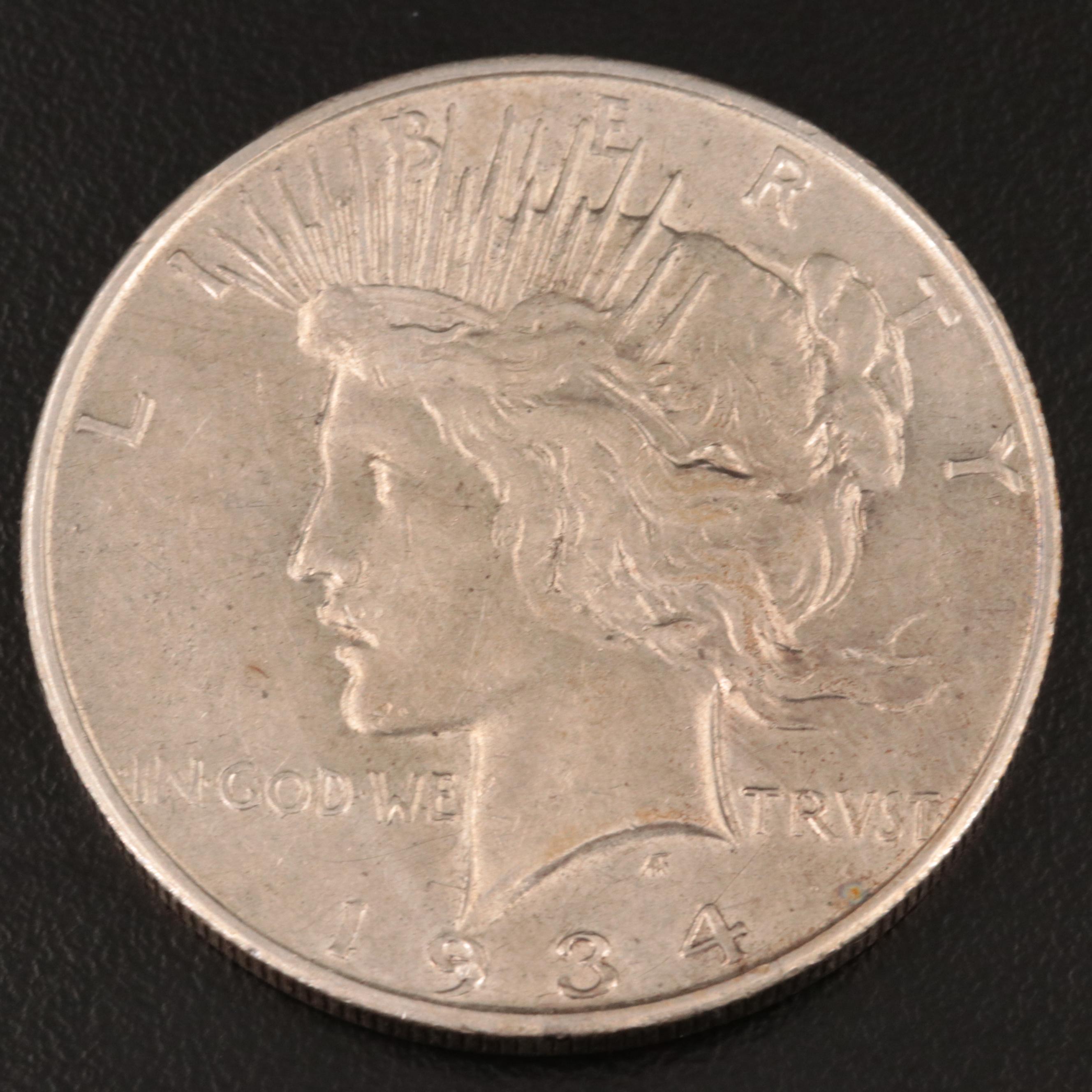 Three Peace Silver Dollars Including 1934-D