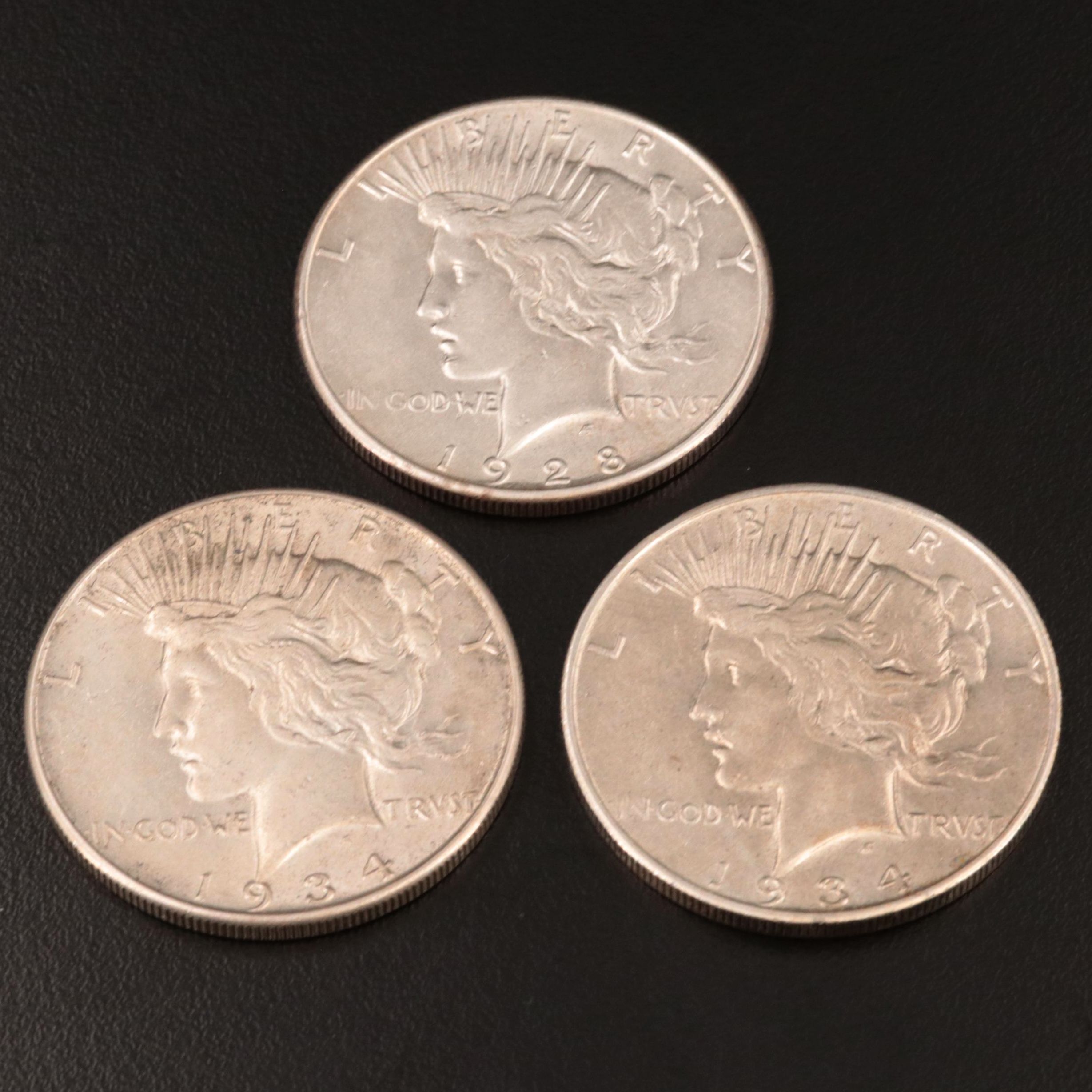 Three Peace Silver Dollars Including 1934-D