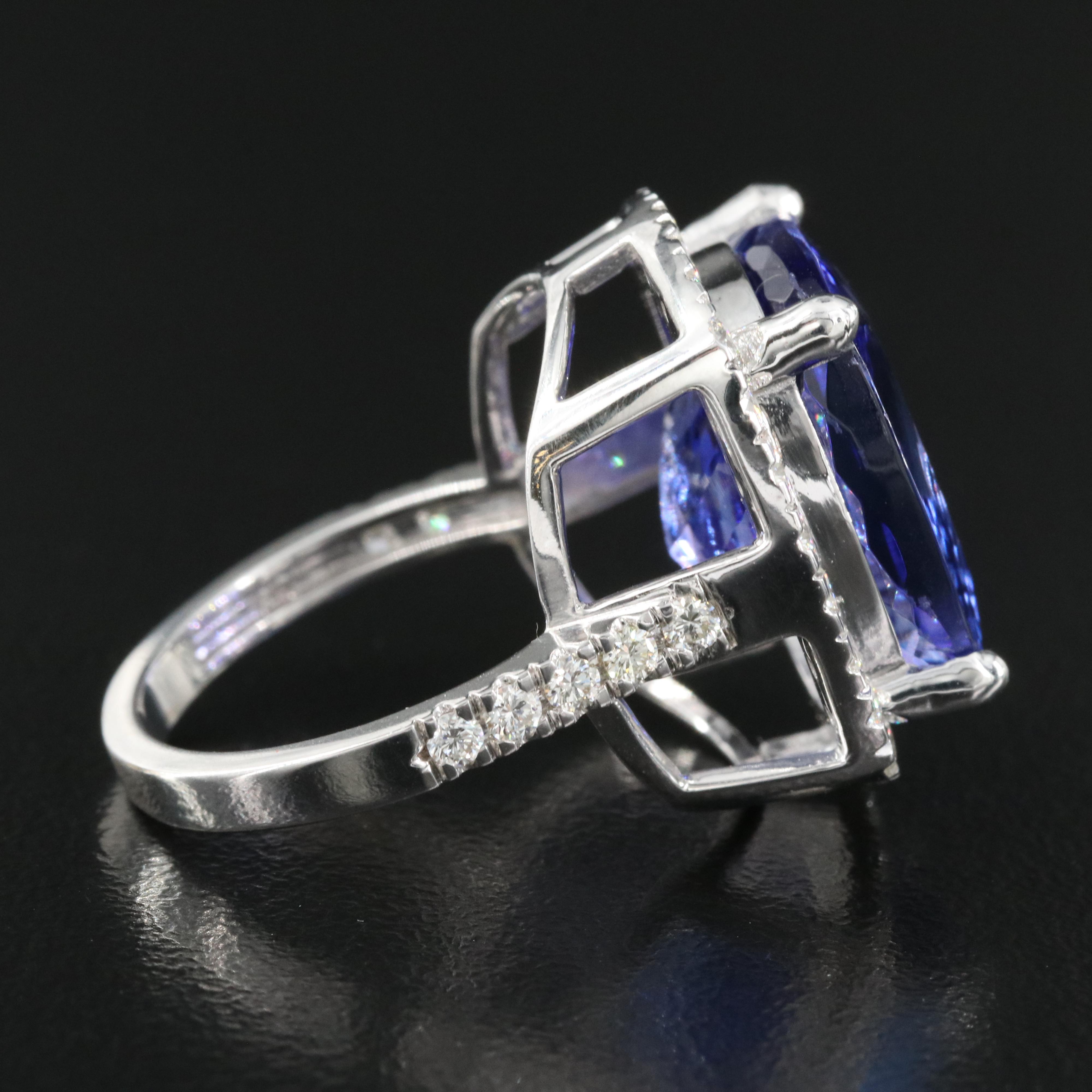 18K 15.57 CT Tanzanite and 1.00 CTW Diamond Halo Ring