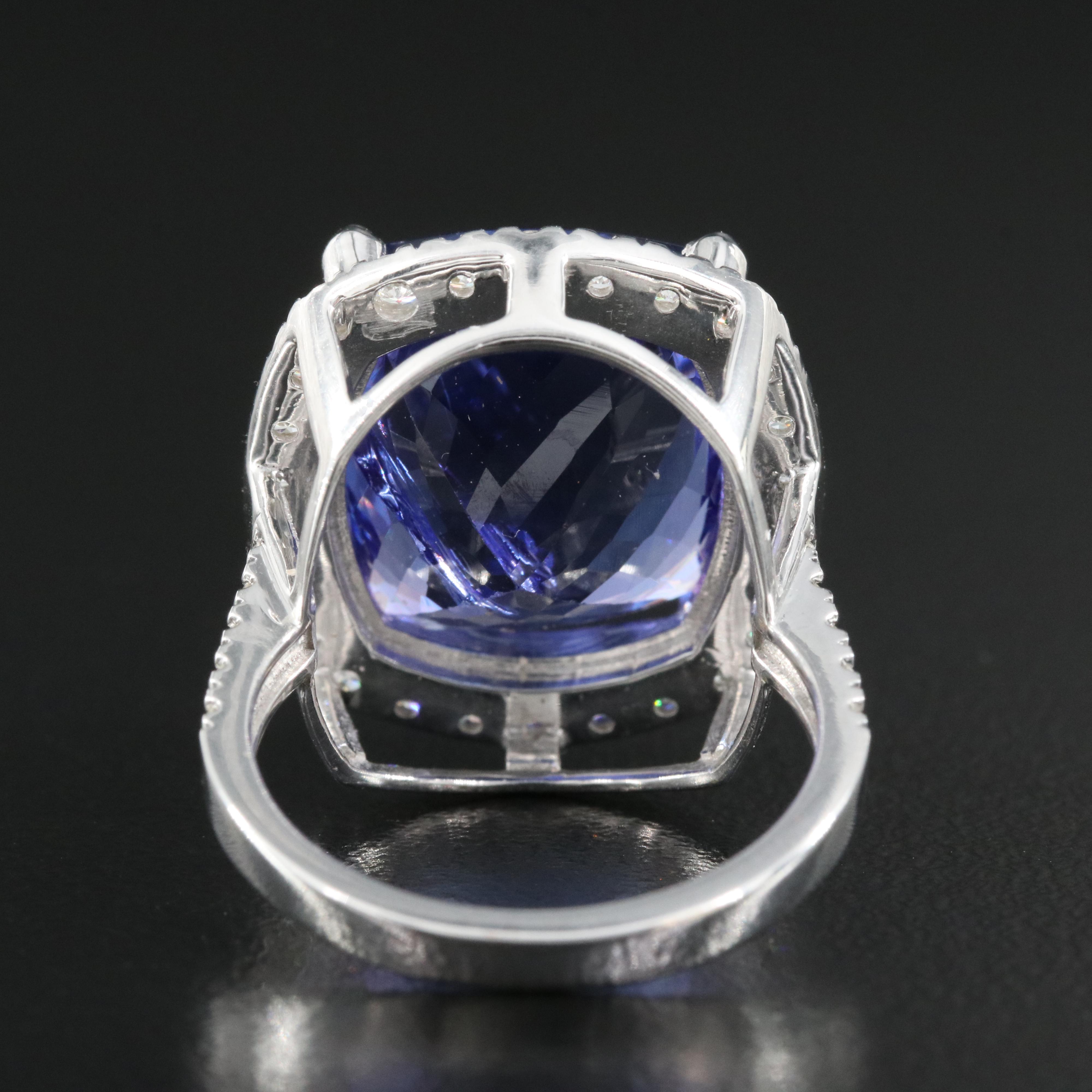 18K 15.57 CT Tanzanite and 1.00 CTW Diamond Halo Ring
