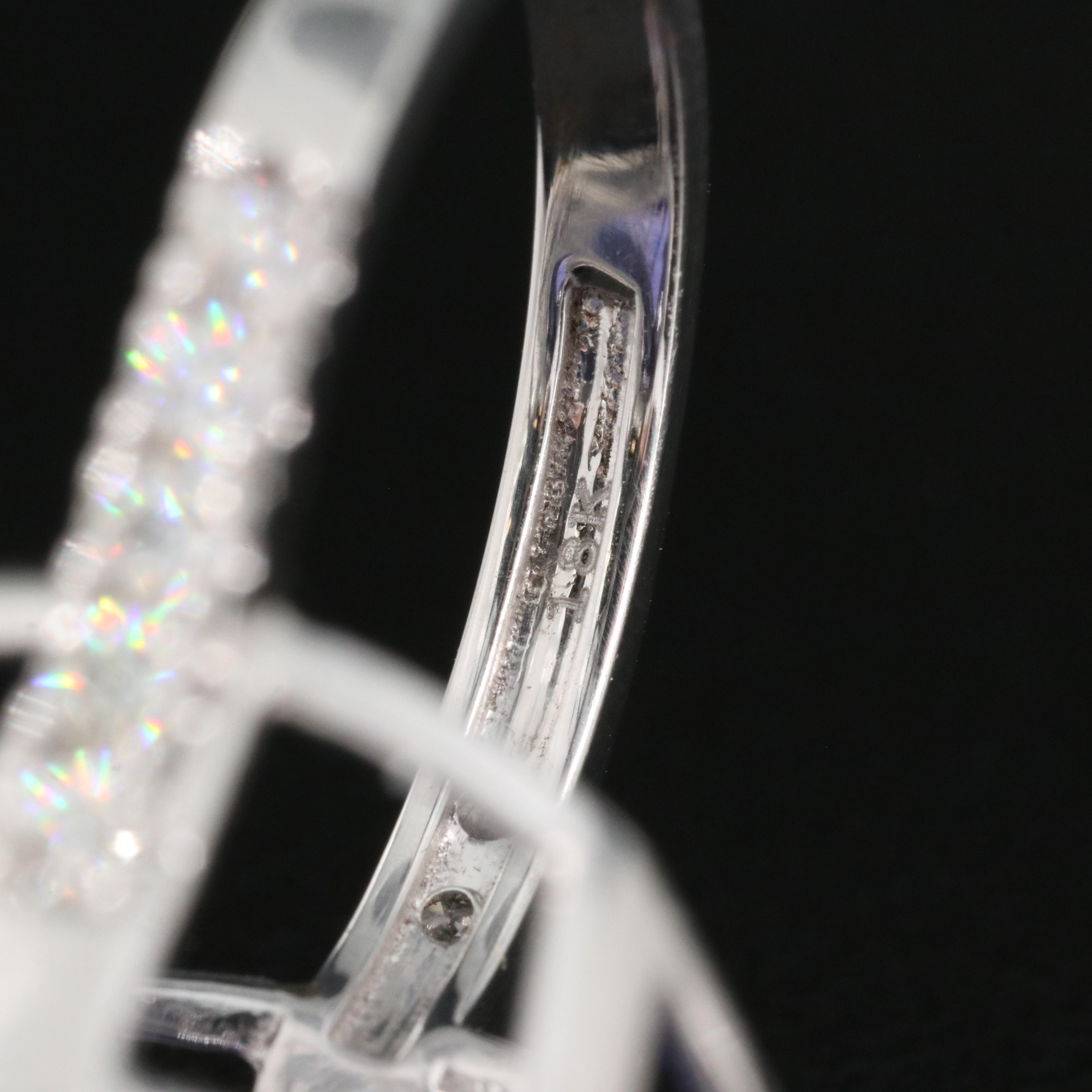 18K 15.57 CT Tanzanite and 1.00 CTW Diamond Halo Ring