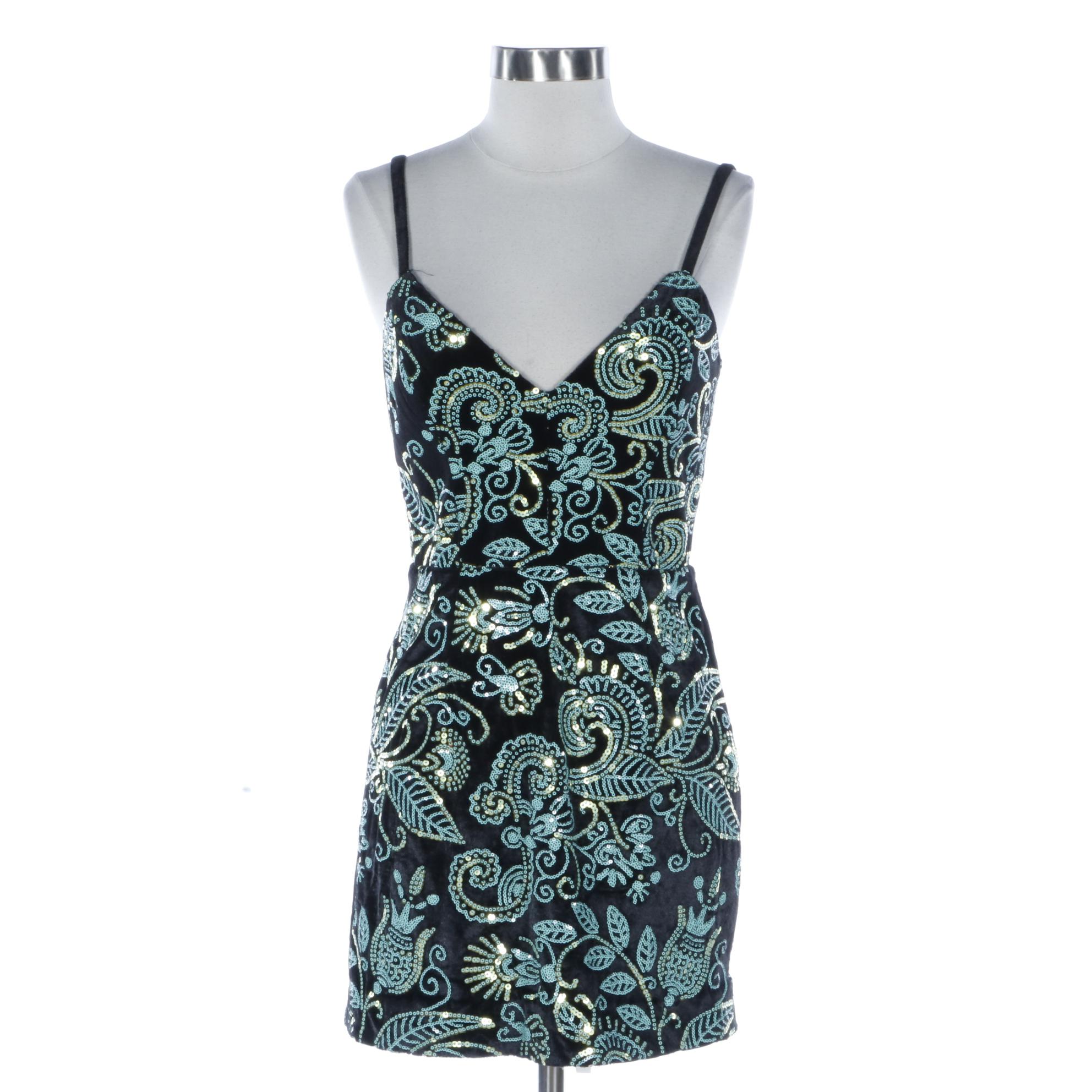 Cosmopolitan Sequined Sleeveless Dress and Bebe Studded Finge Vest