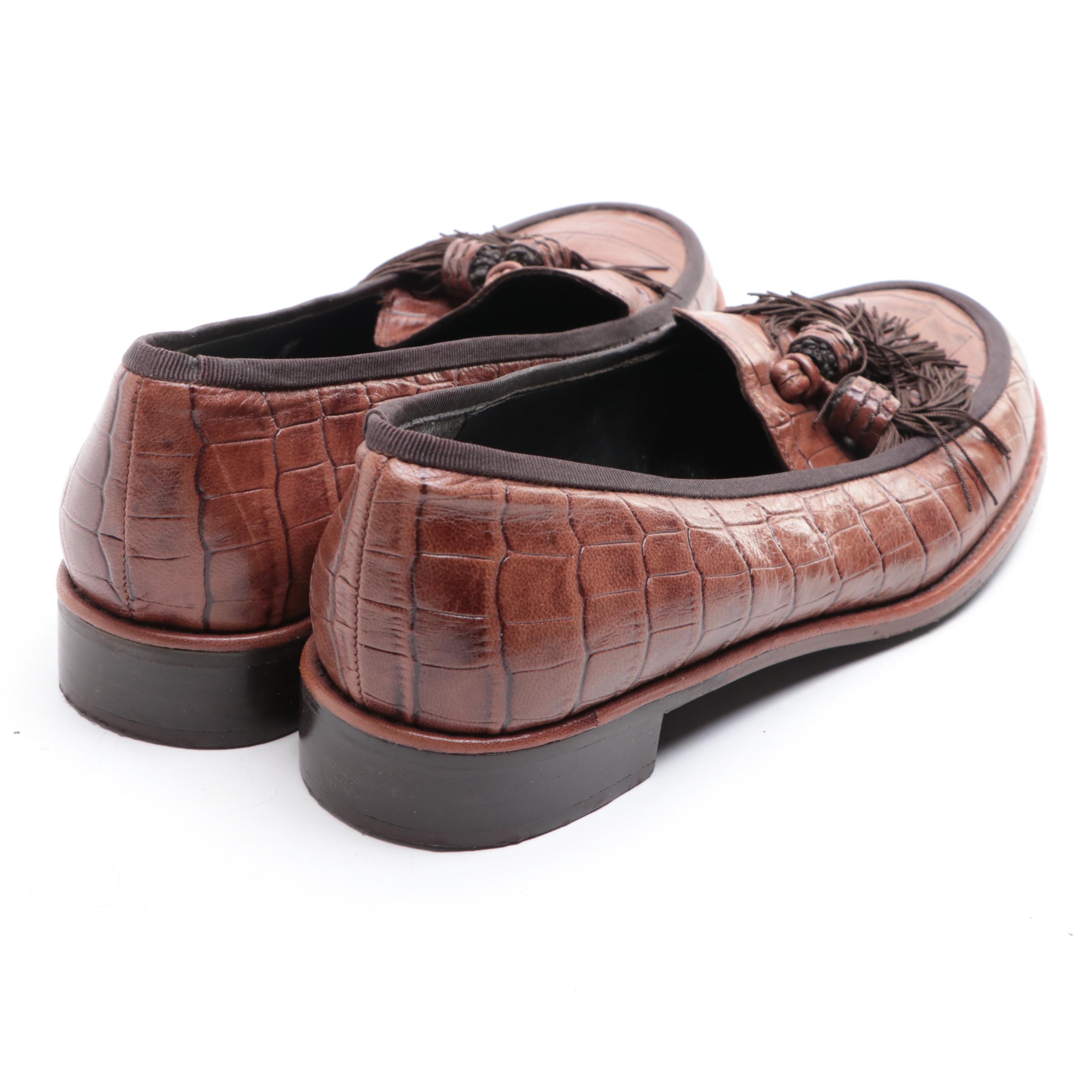 Stuart Weitzman Embossed Leather Loafers and Tory Burch Flip-Flops