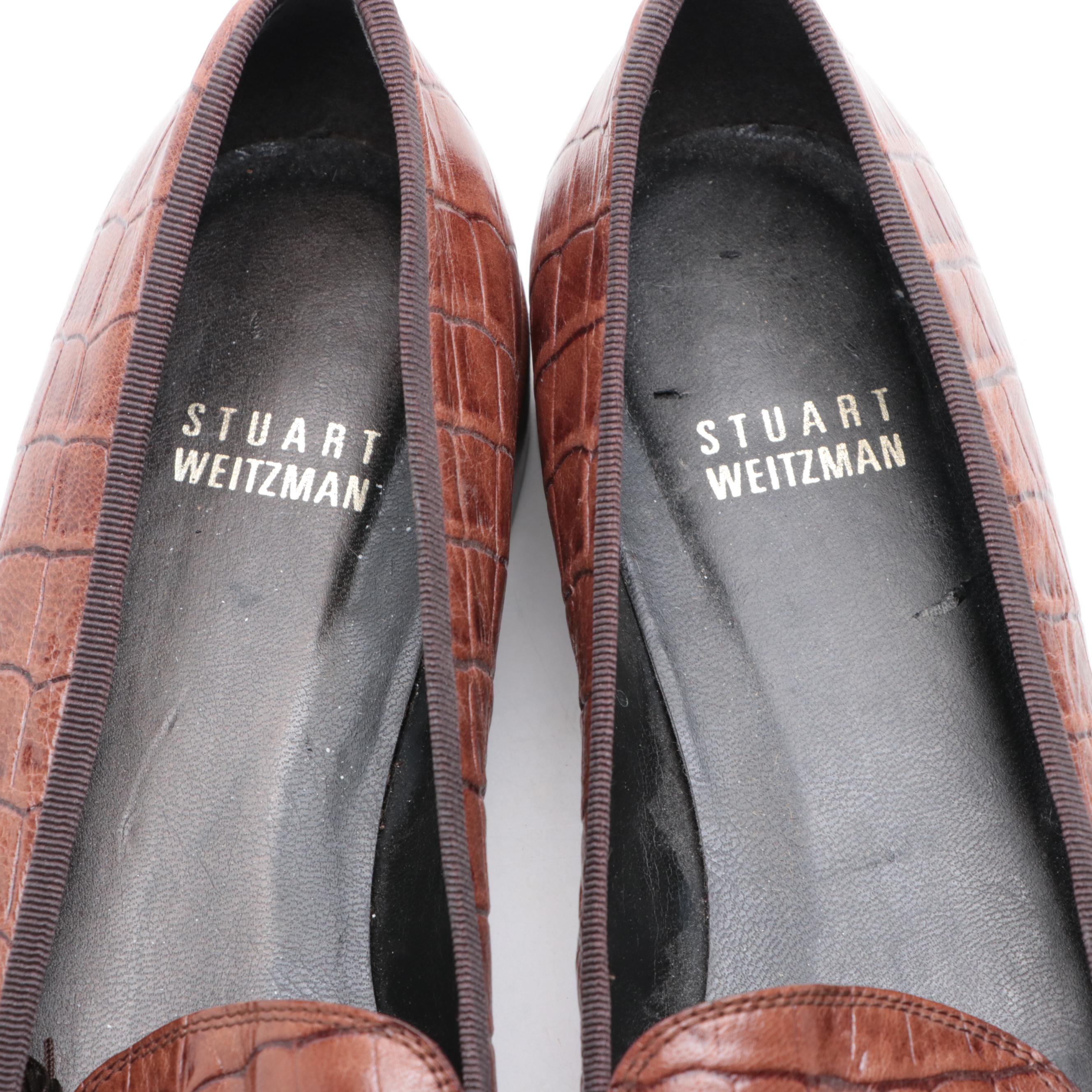 Stuart Weitzman Embossed Leather Loafers and Tory Burch Flip-Flops