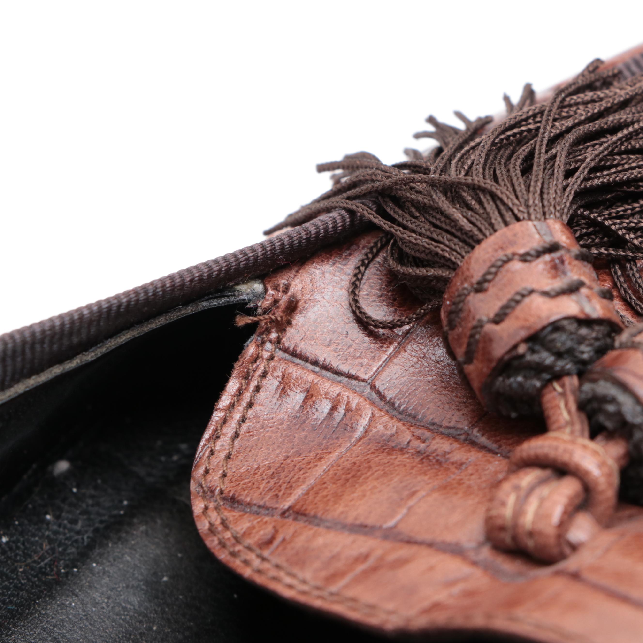 Stuart Weitzman Embossed Leather Loafers and Tory Burch Flip-Flops