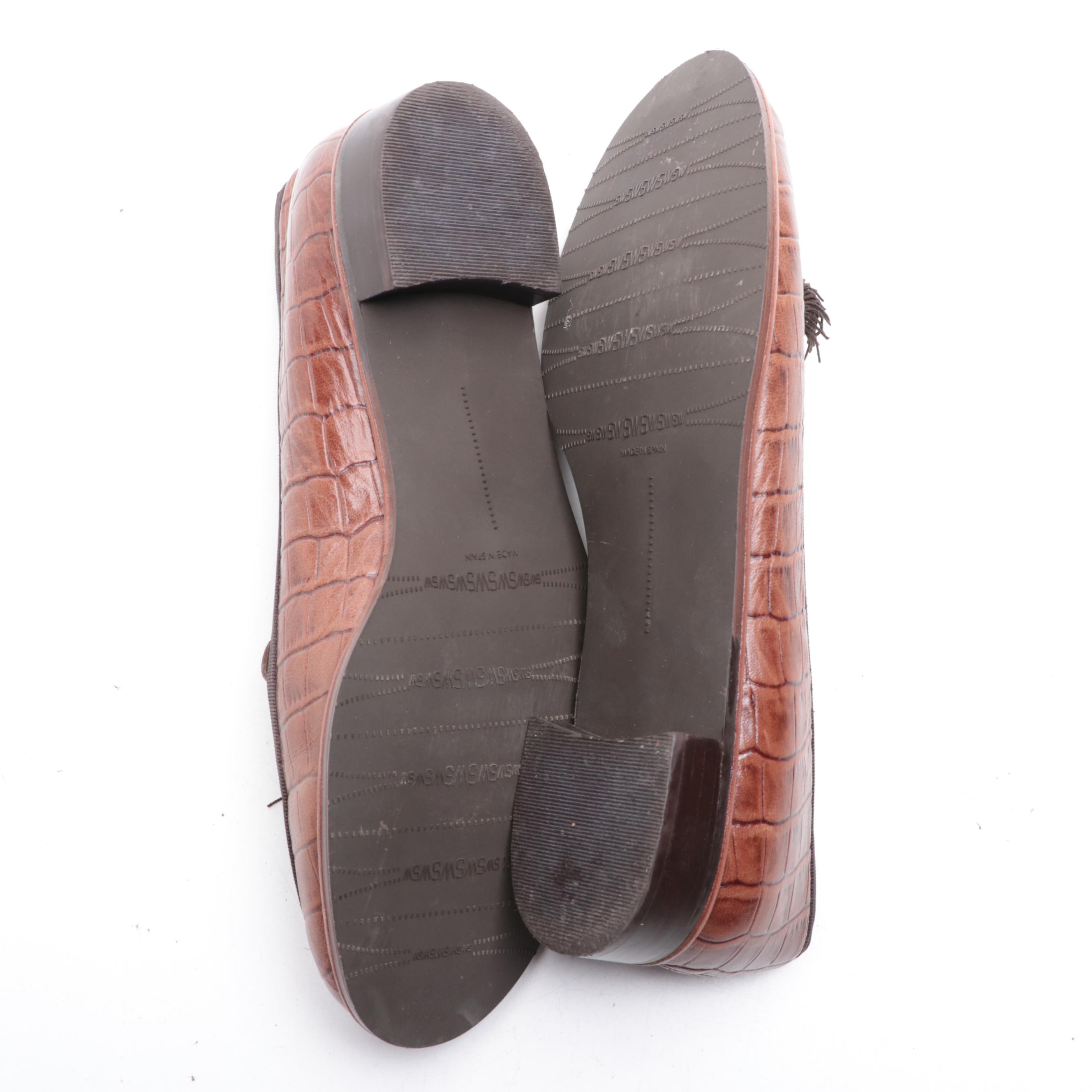 Stuart Weitzman Embossed Leather Loafers and Tory Burch Flip-Flops