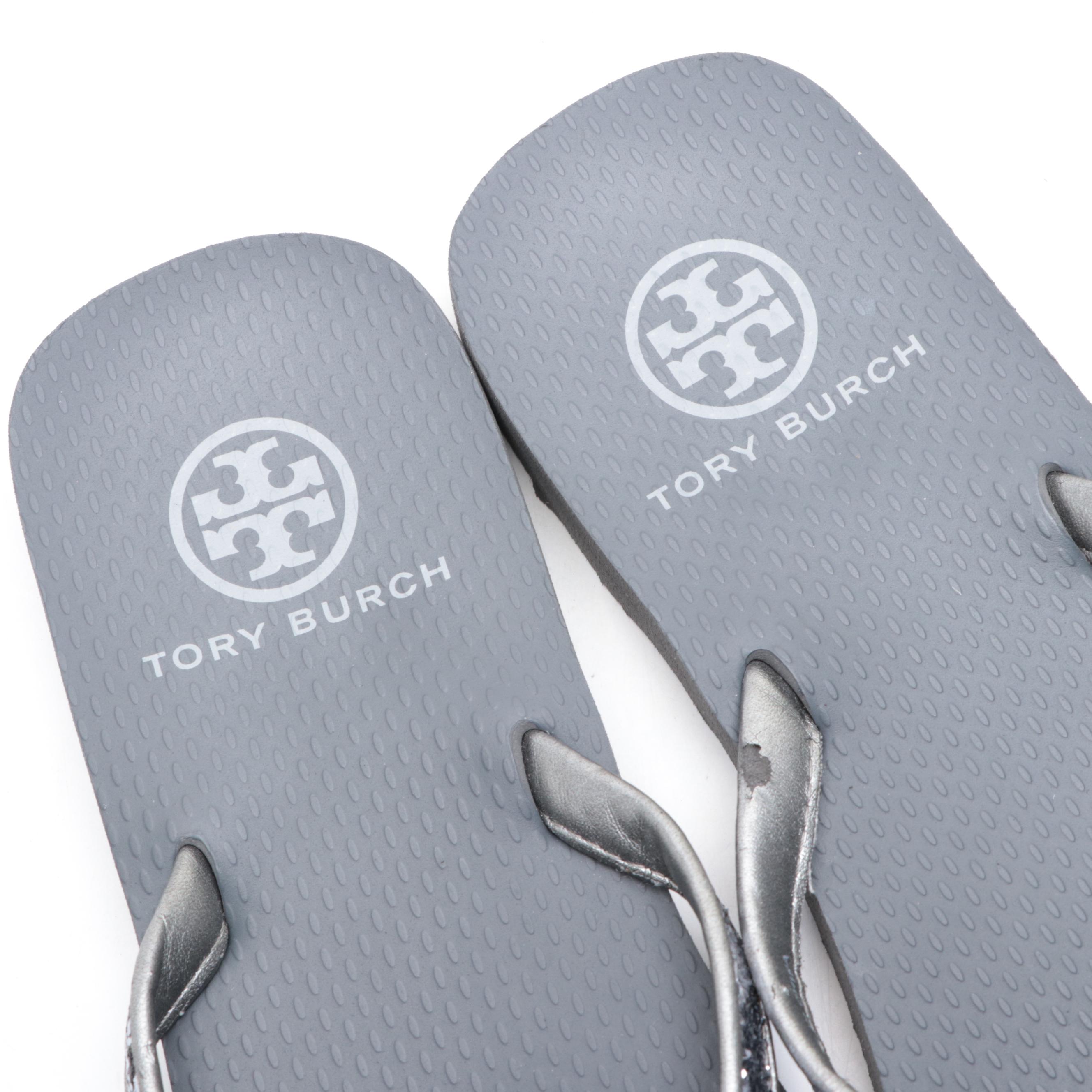 Stuart Weitzman Embossed Leather Loafers and Tory Burch Flip-Flops