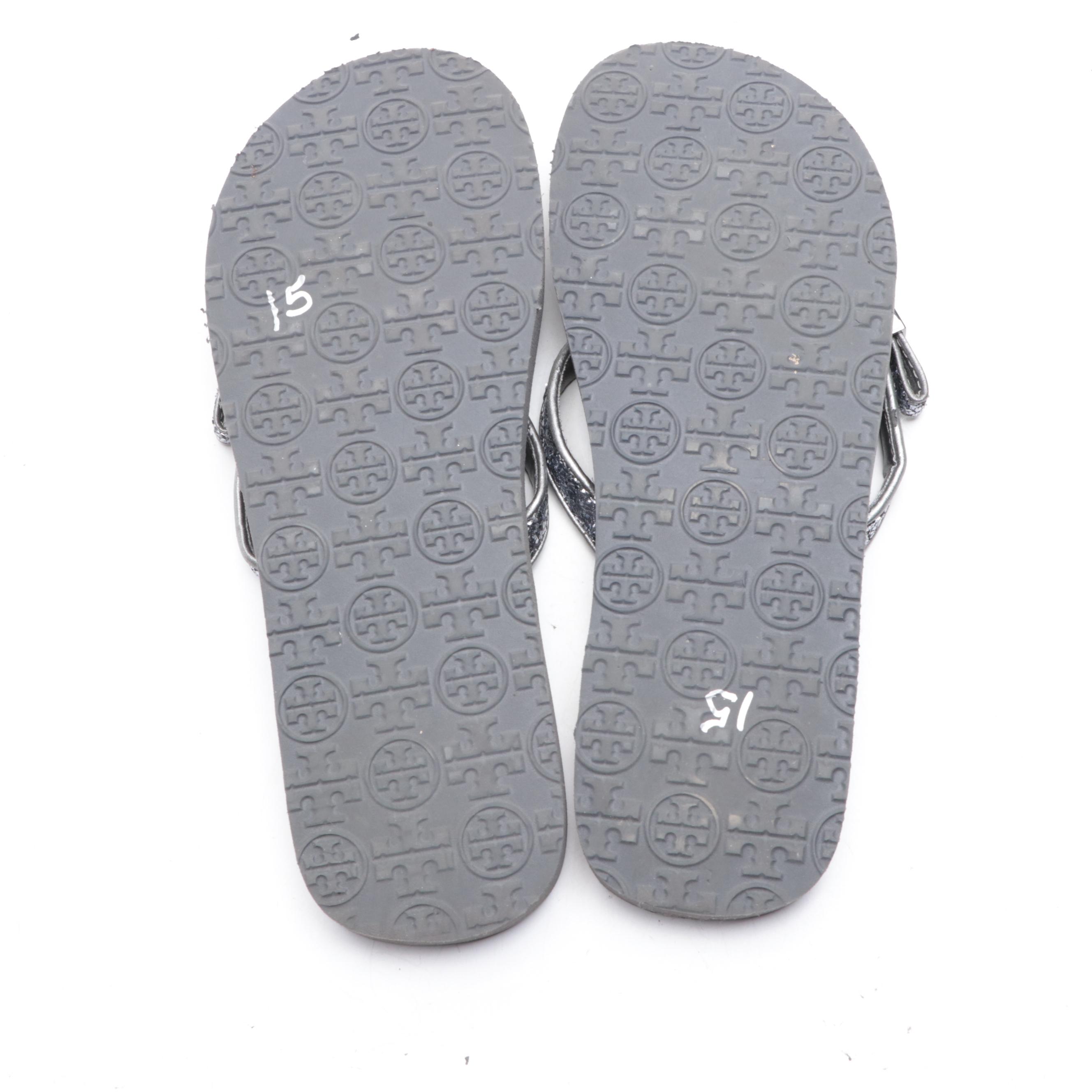 Stuart Weitzman Embossed Leather Loafers and Tory Burch Flip-Flops