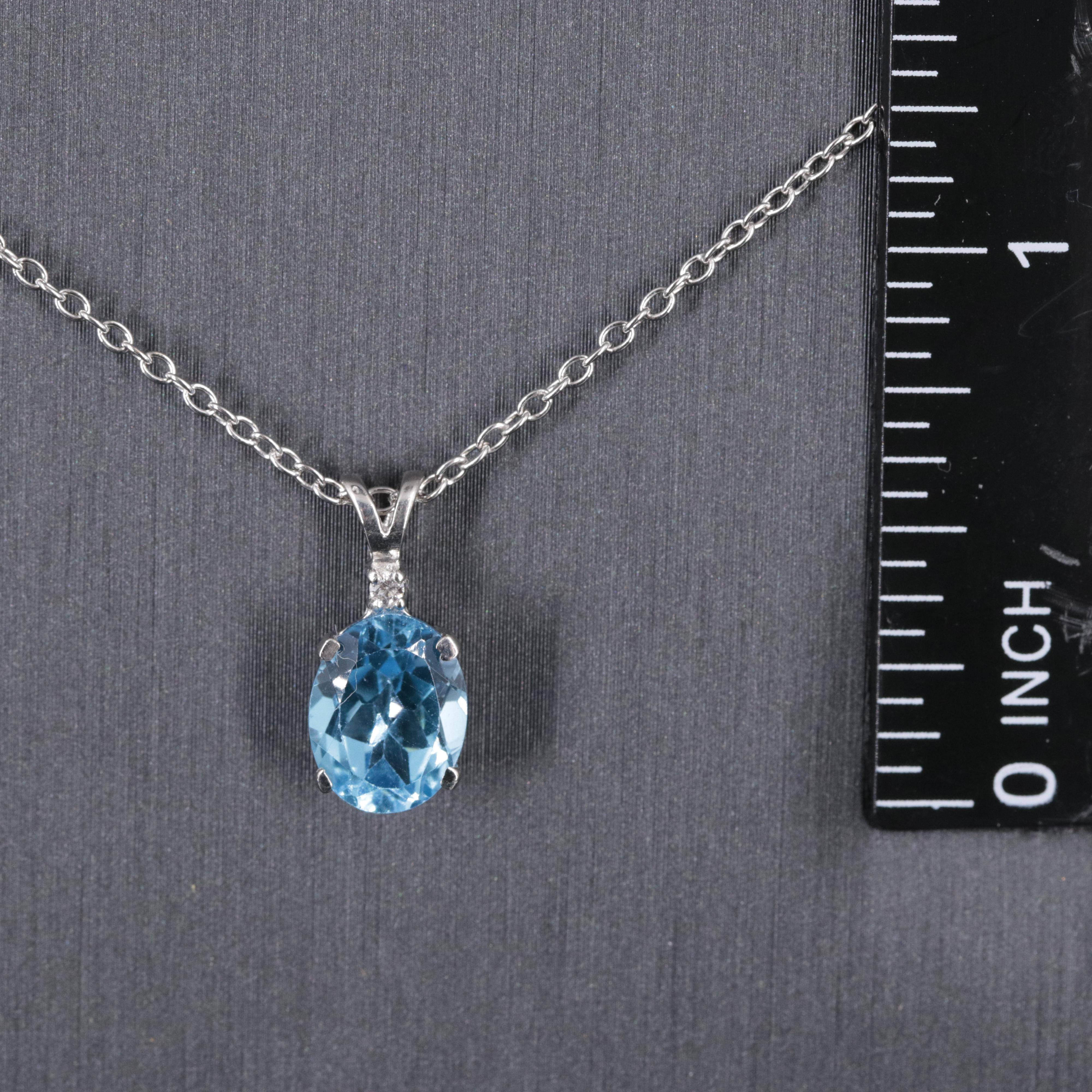 Sterling Silver Pendant Necklace Featuring Topaz
