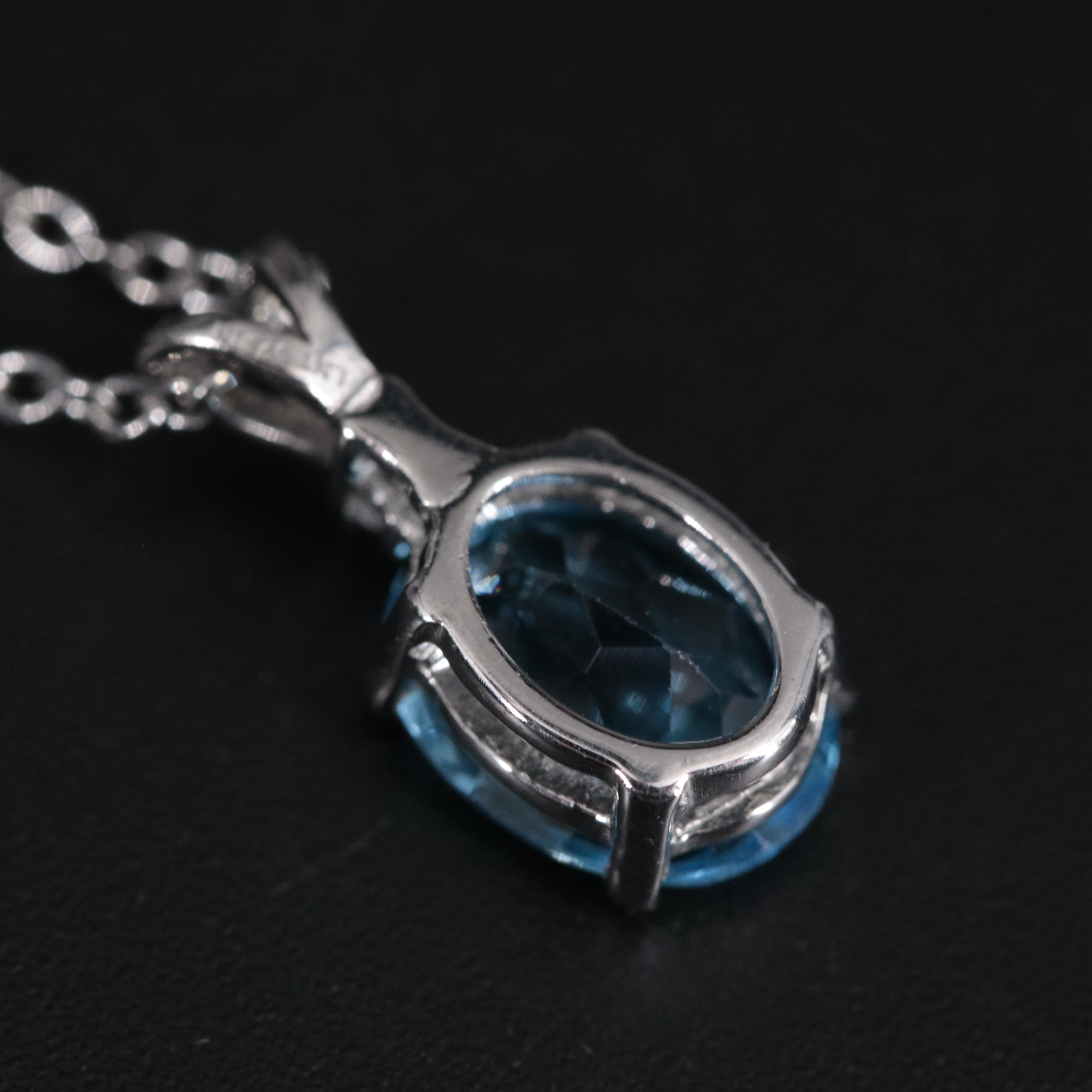 Sterling Silver Pendant Necklace Featuring Topaz