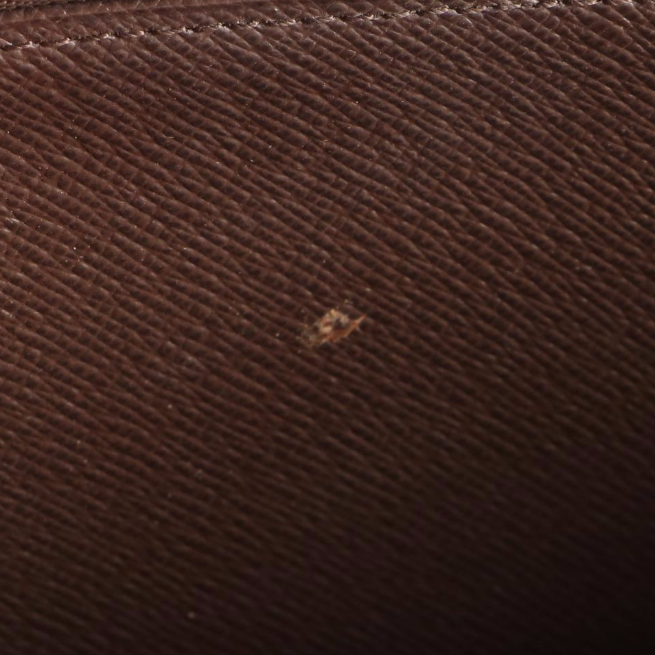 Louis Vuitton Zippy Wallet in Damier Ebene Canvas