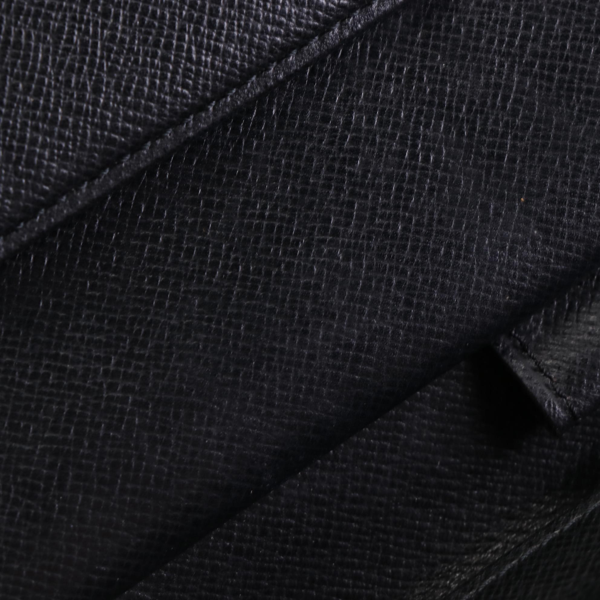 Louis Vuitton Porte-Tresór International Wallet in Black Epi Leather