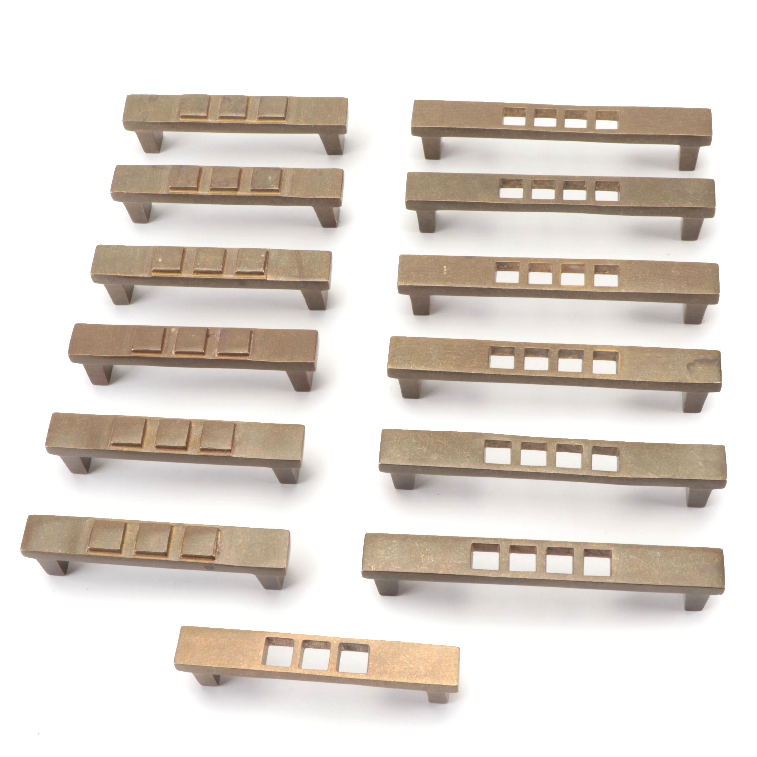 Punched and Embossed Elongated Cabinet Pulls in Natural Bronze Finish