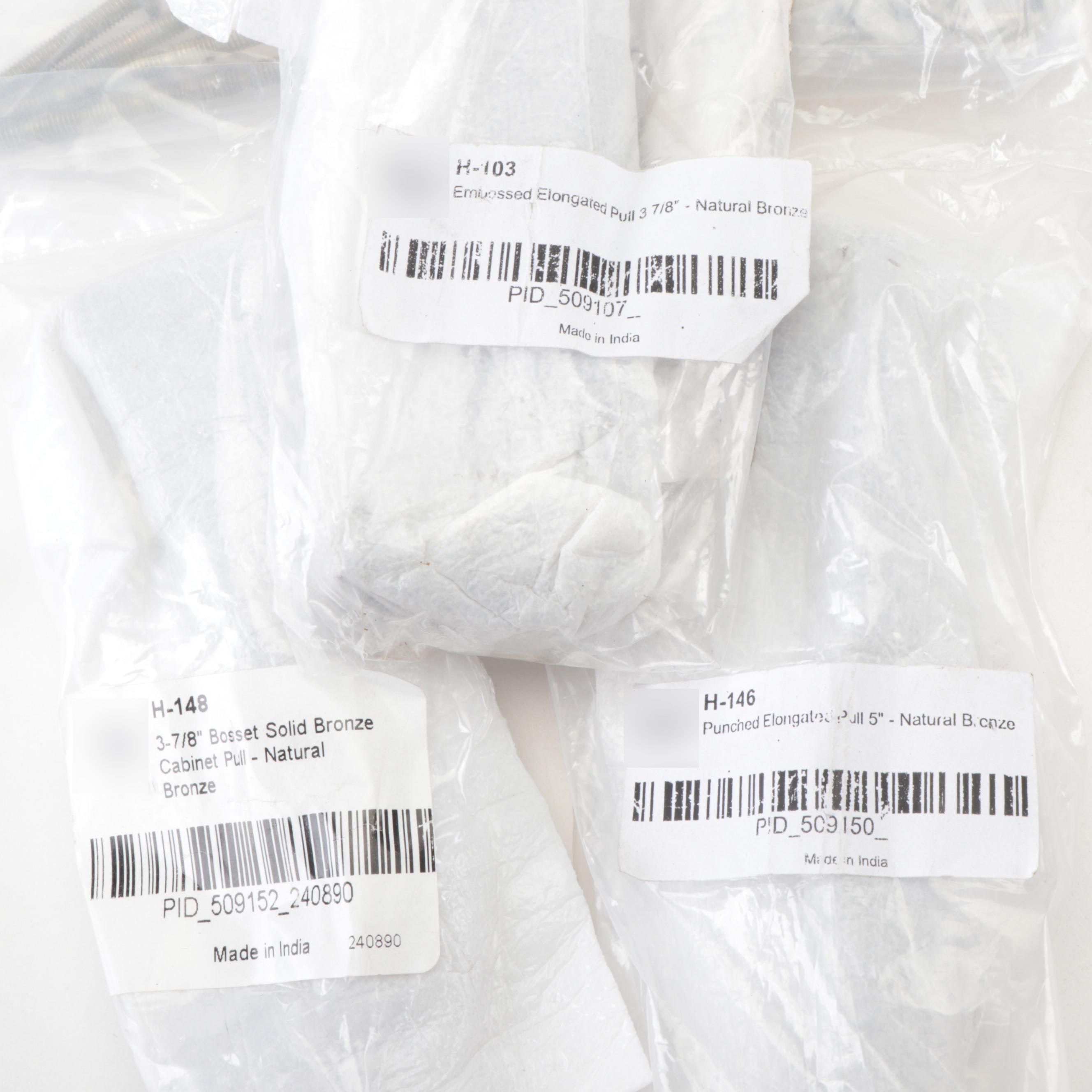 Punched and Embossed Elongated Cabinet Pulls in Natural Bronze Finish