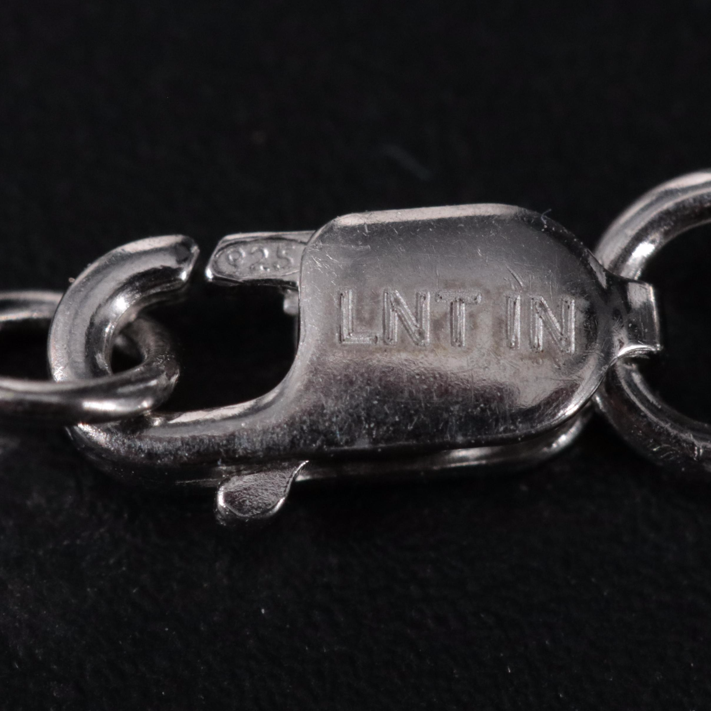 Sterling Pendant Necklace Featuring Topaz and Cubic Zirconia