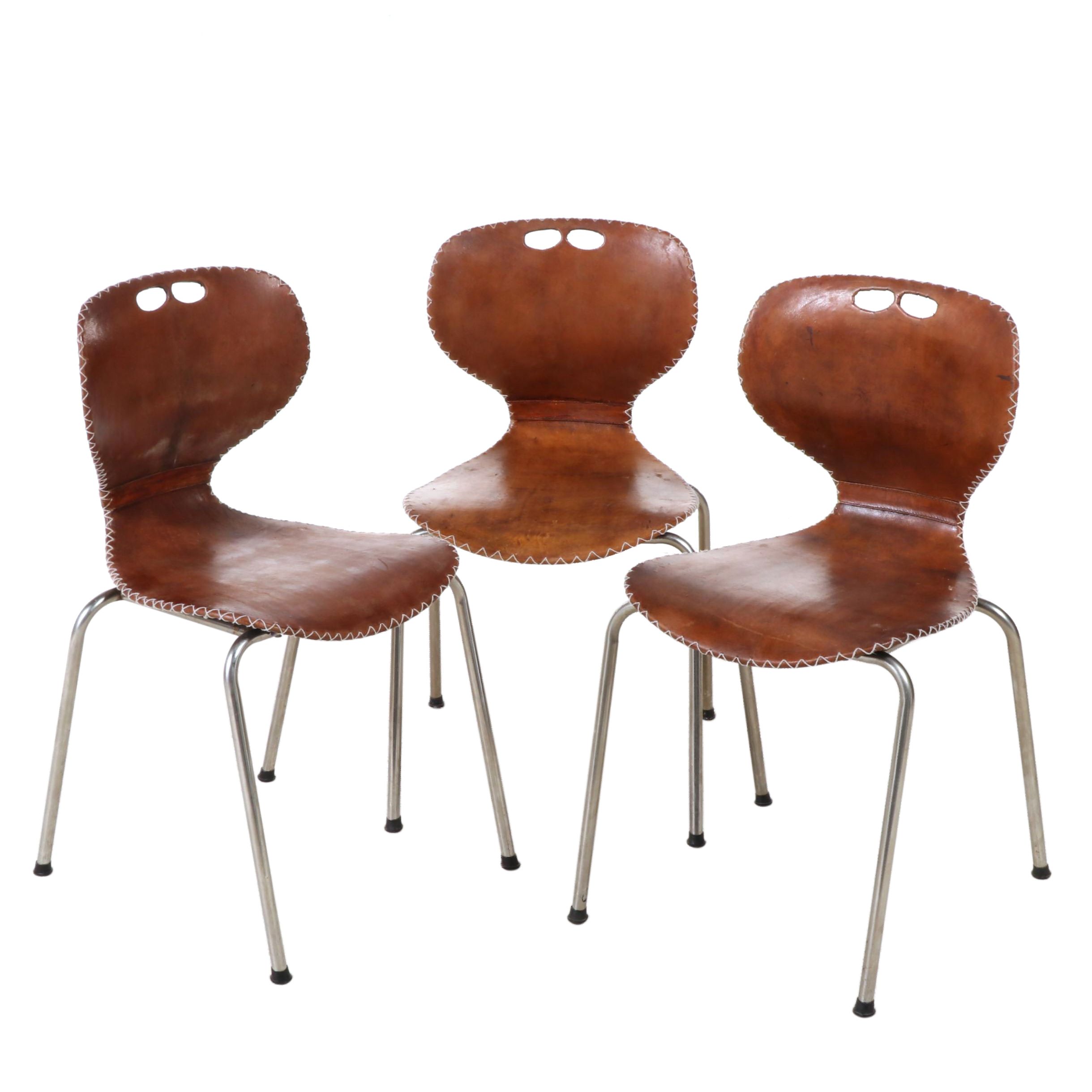 Three Modernist Tubular Metal, Molded Plastic and Leather Stacking Chairs