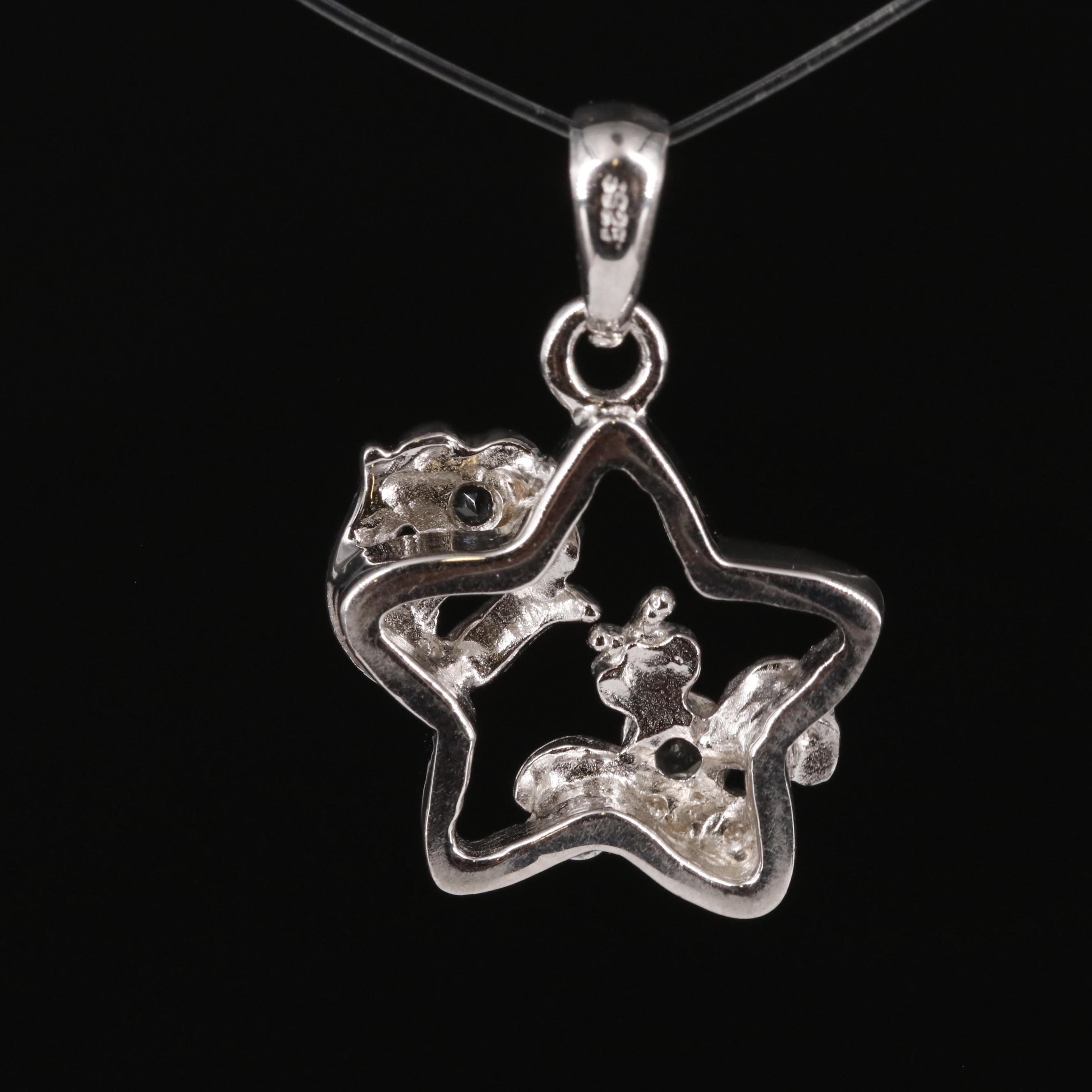 Sterling Aquamarine Star Pendant with Flower Accents