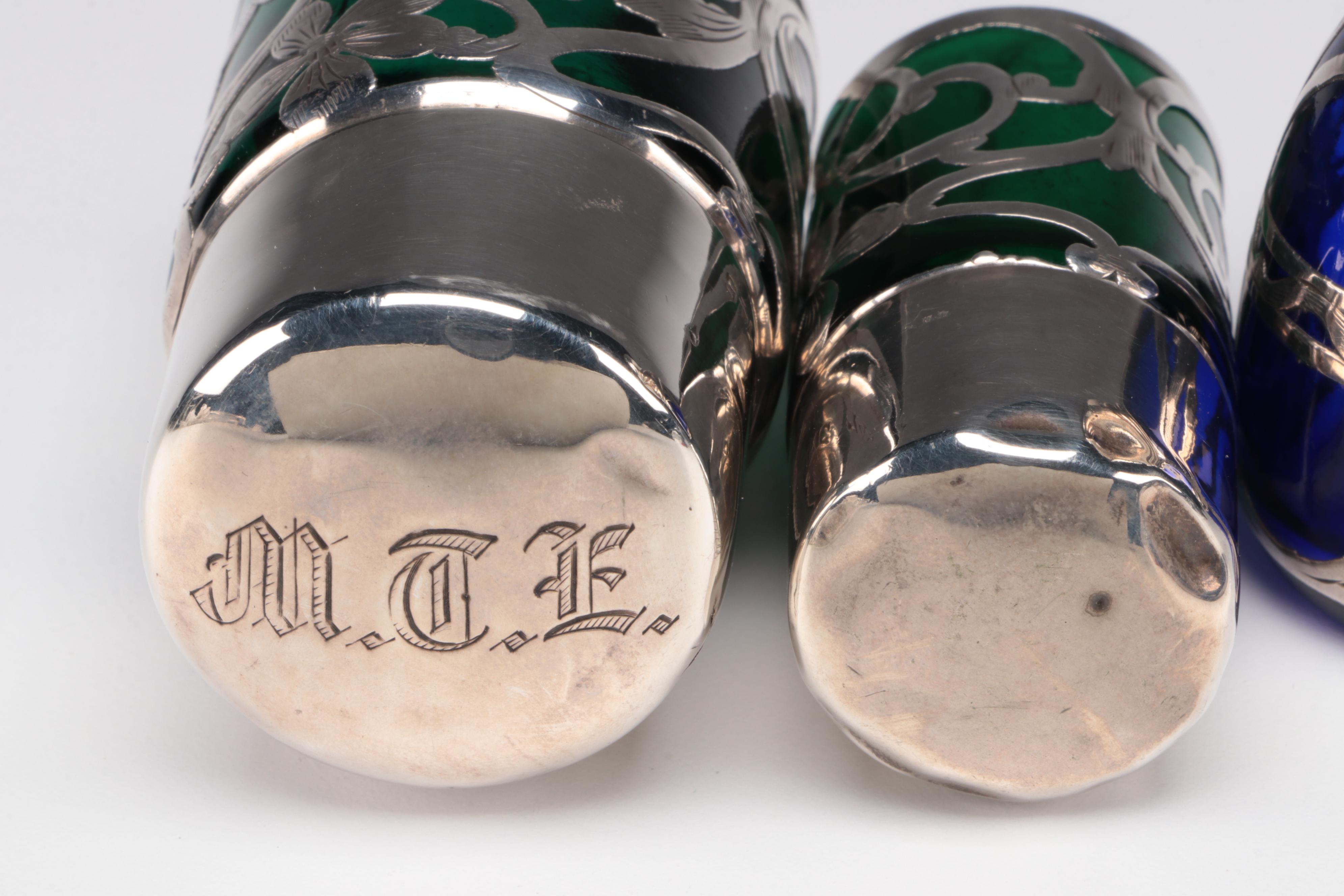 Sterling Silver Overlay and Emerald Glass Vanity Bottles with Other Shaker