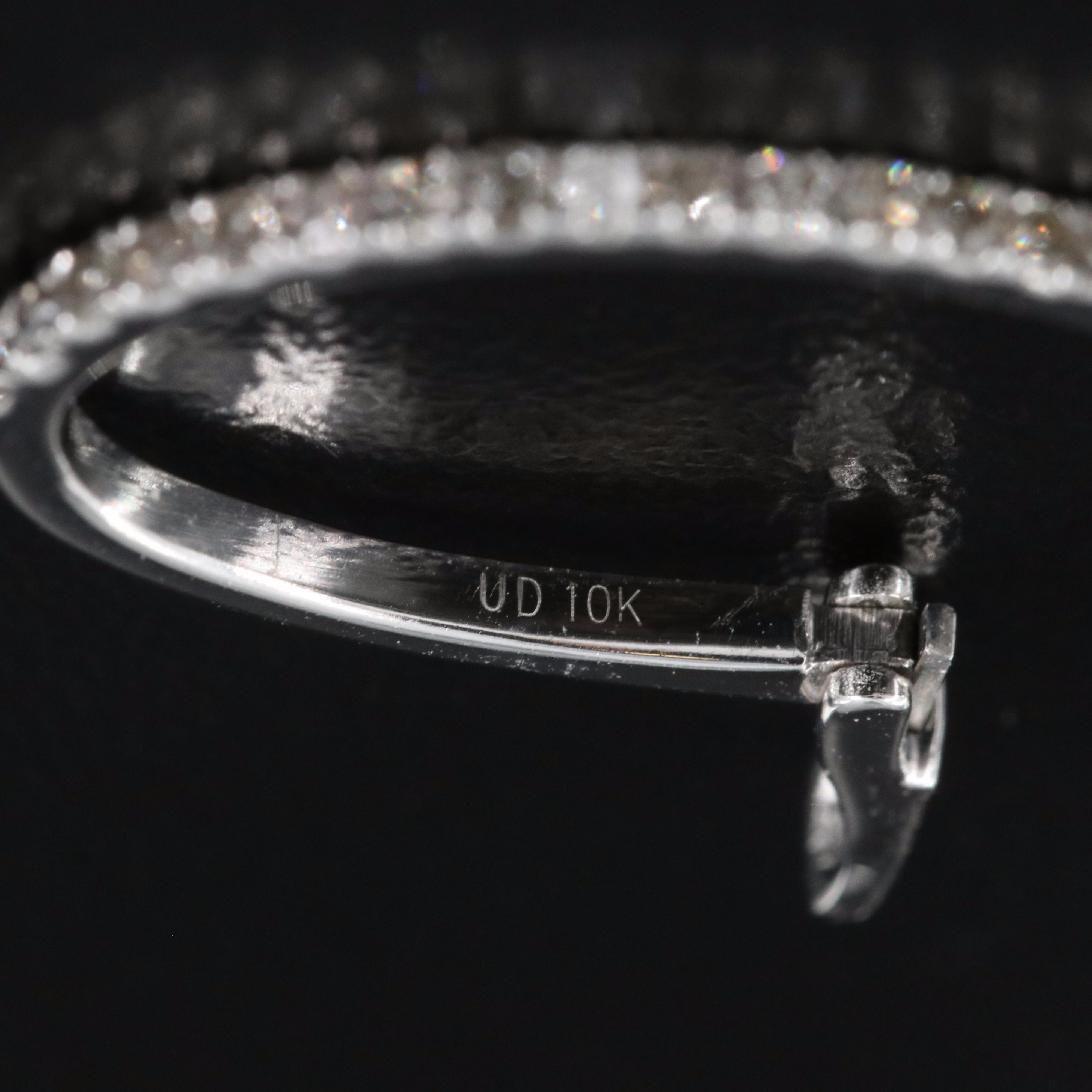 10K 0.30 CTW Diamond Oval Hoop Earrings