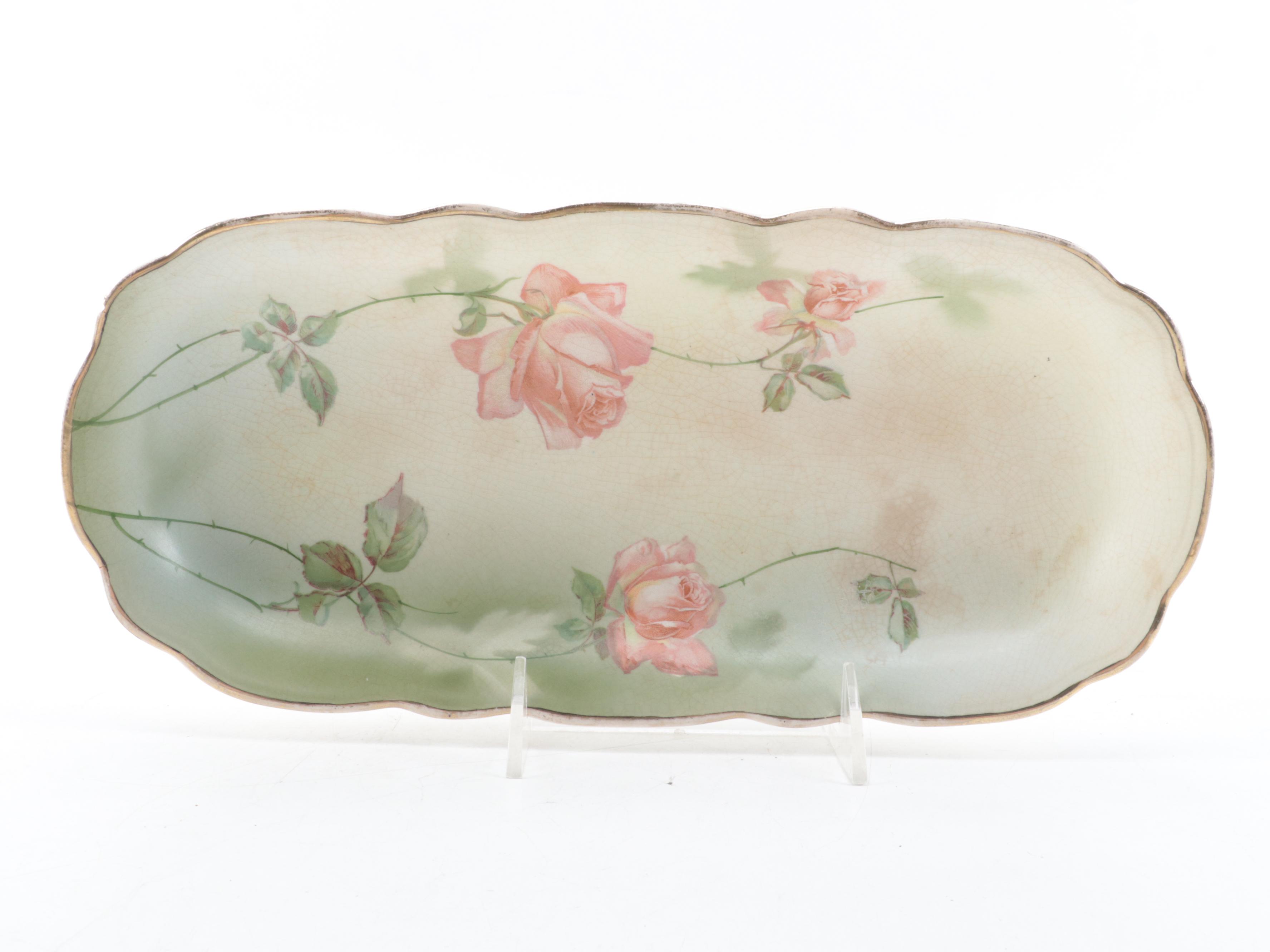 Stinthal China Celery Dish with Brass Chambersticks and Utensils