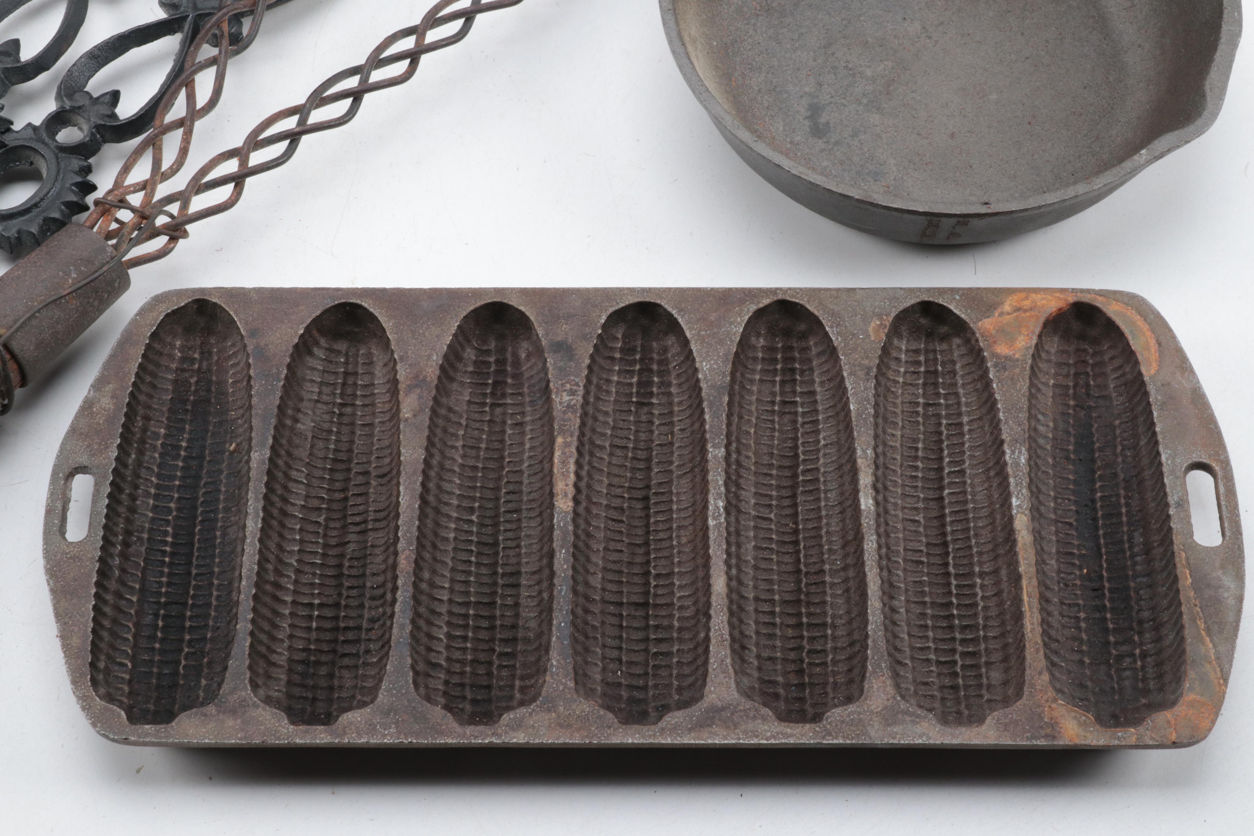 Cast Iron Lidded Pot, Cornbread Pan, Skillet, Rug Beater, Ice Tongs, and More