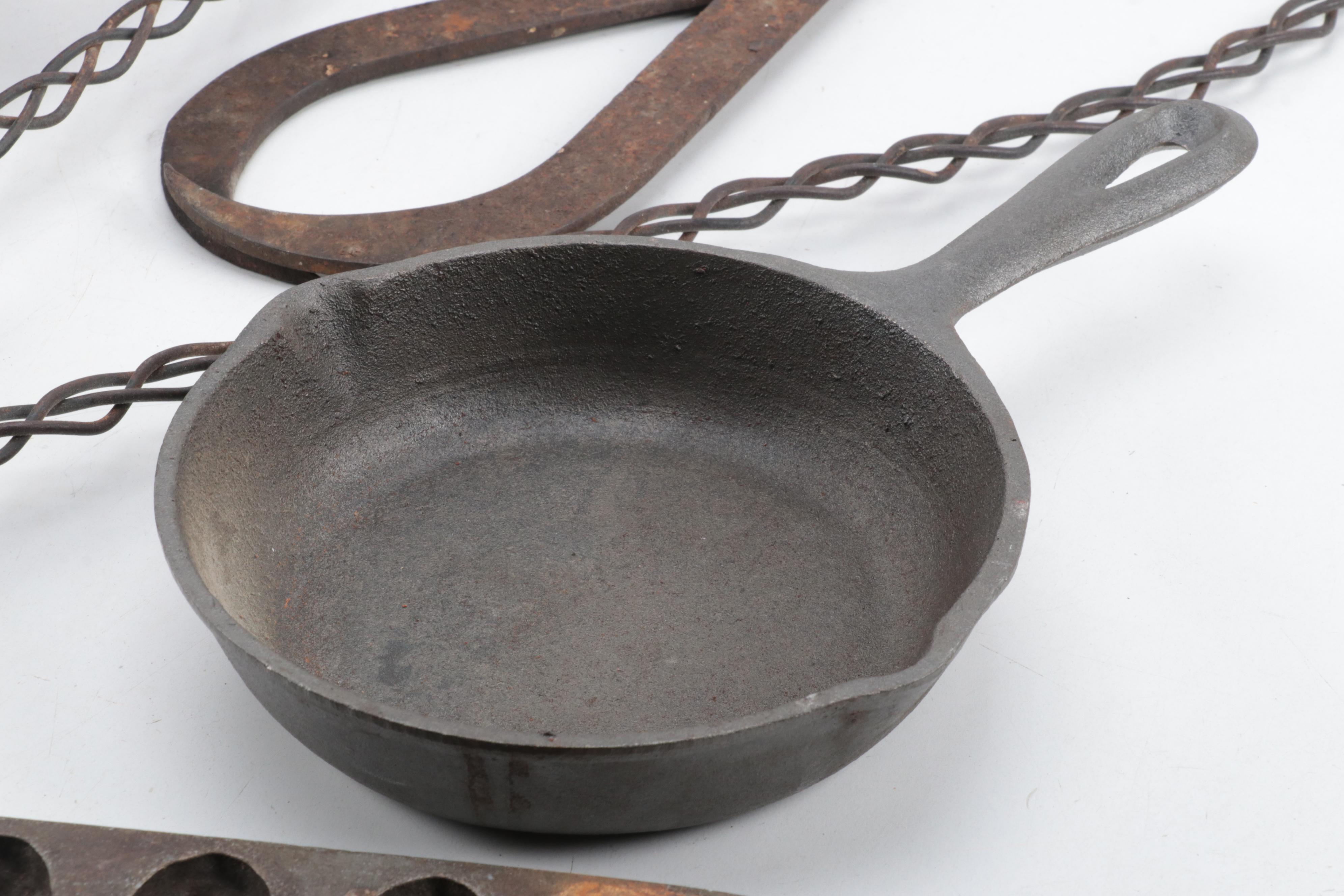 Cast Iron Lidded Pot, Cornbread Pan, Skillet, Rug Beater, Ice Tongs, and More